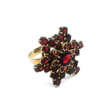 Vintage silver gilt ring set with bohemian garnets in a star design.