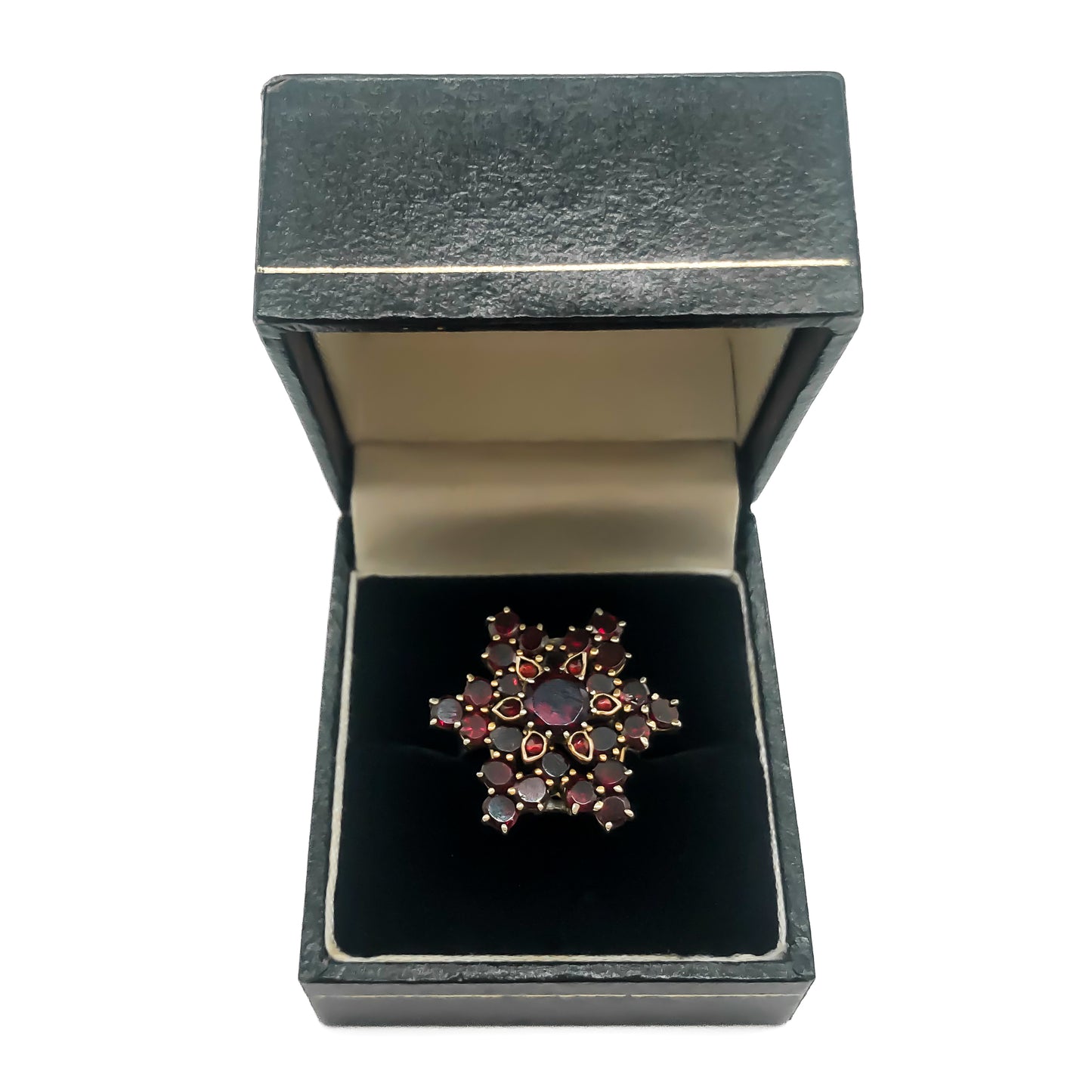Vintage silver gilt ring set with bohemian garnets in a star design.
