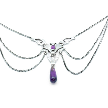 Stylish silver Jugendstil festoon necklace set with an oval amethyst, an amethyst drop and two small seed pearls. 