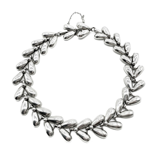 Stylish silver repoussé choker necklace with a safety chain attached. Argentina