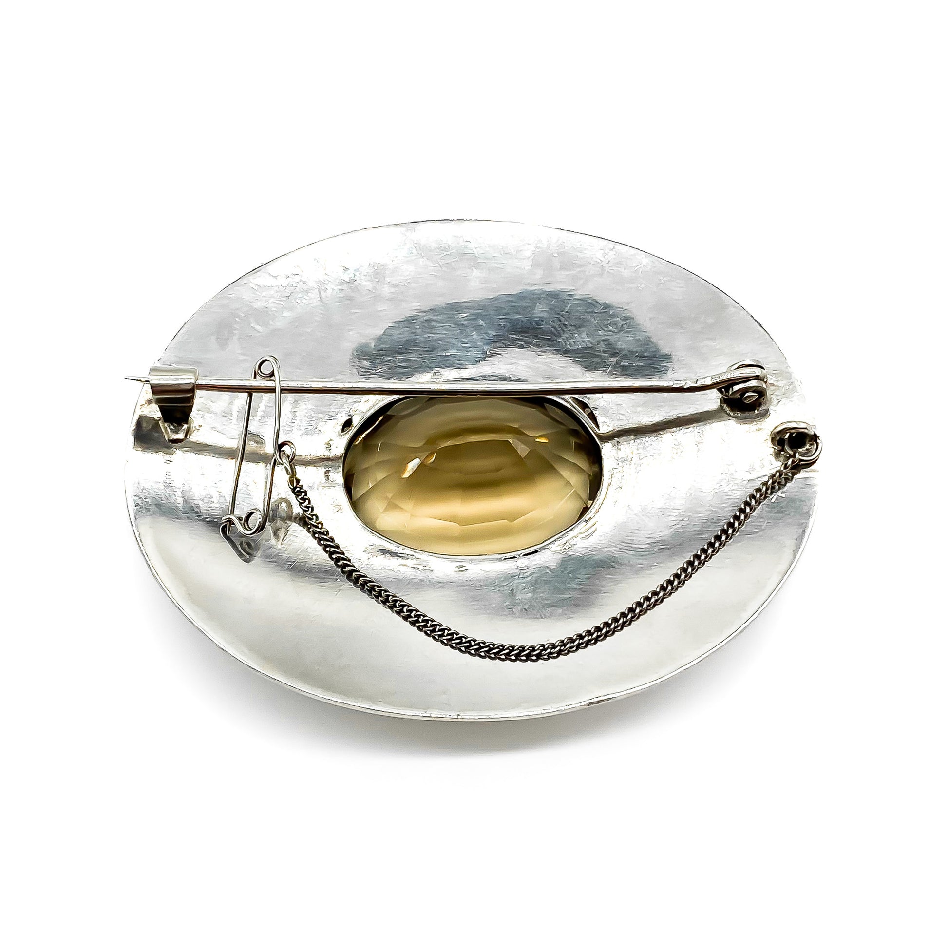 Impressive vintage silver handmade brooch set with a beautifully faceted oval smoky quartz.   Circa 1950’s