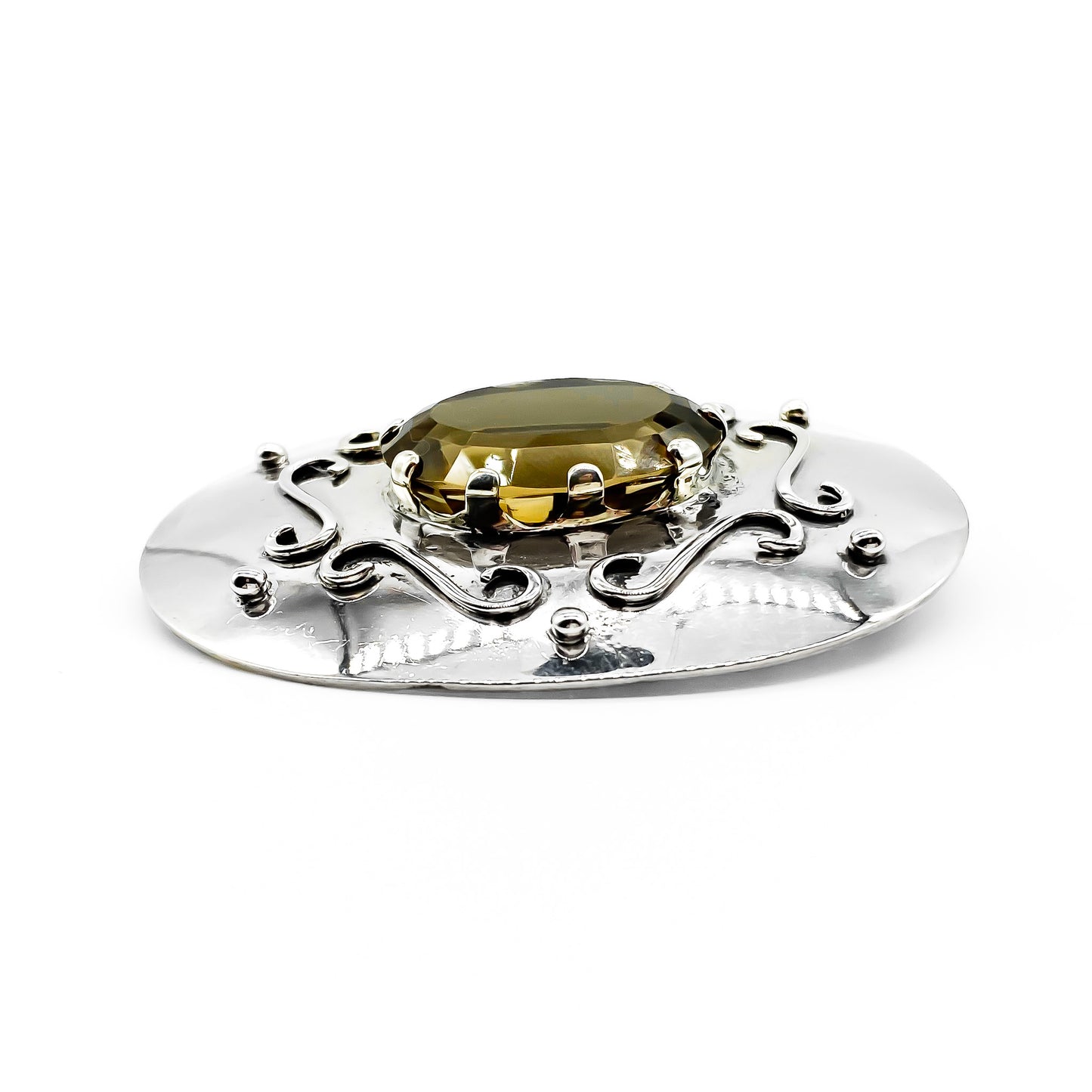 Impressive vintage silver handmade brooch set with a beautifully faceted oval smoky quartz. Circa 1950’s