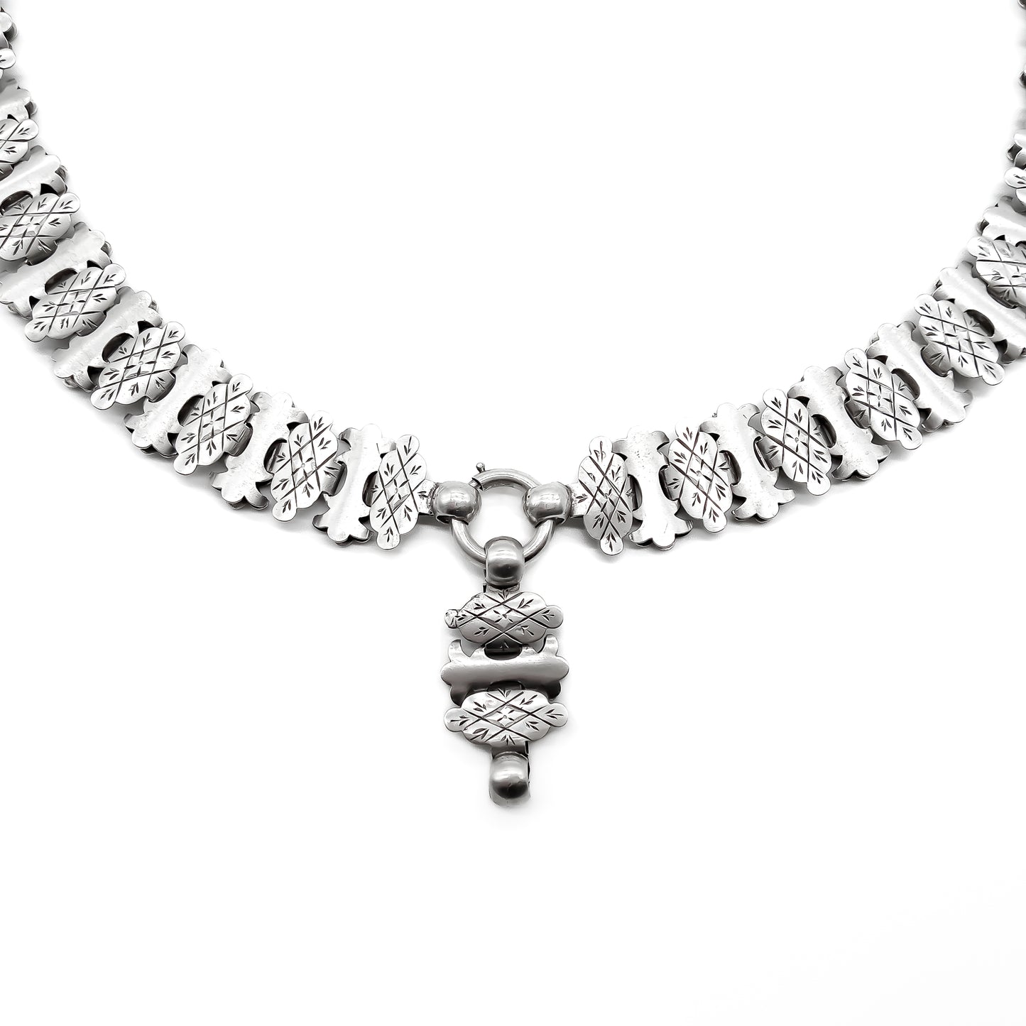 Classic Victorian silver choker with beautifully engraved links and an attachment to add a locket or medallion.