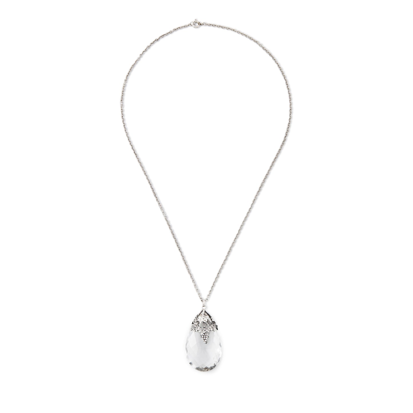 Lovely large Art Nouveau rock crystal teardrop pendant with silver grape leaf embellishment. On a silver chain.