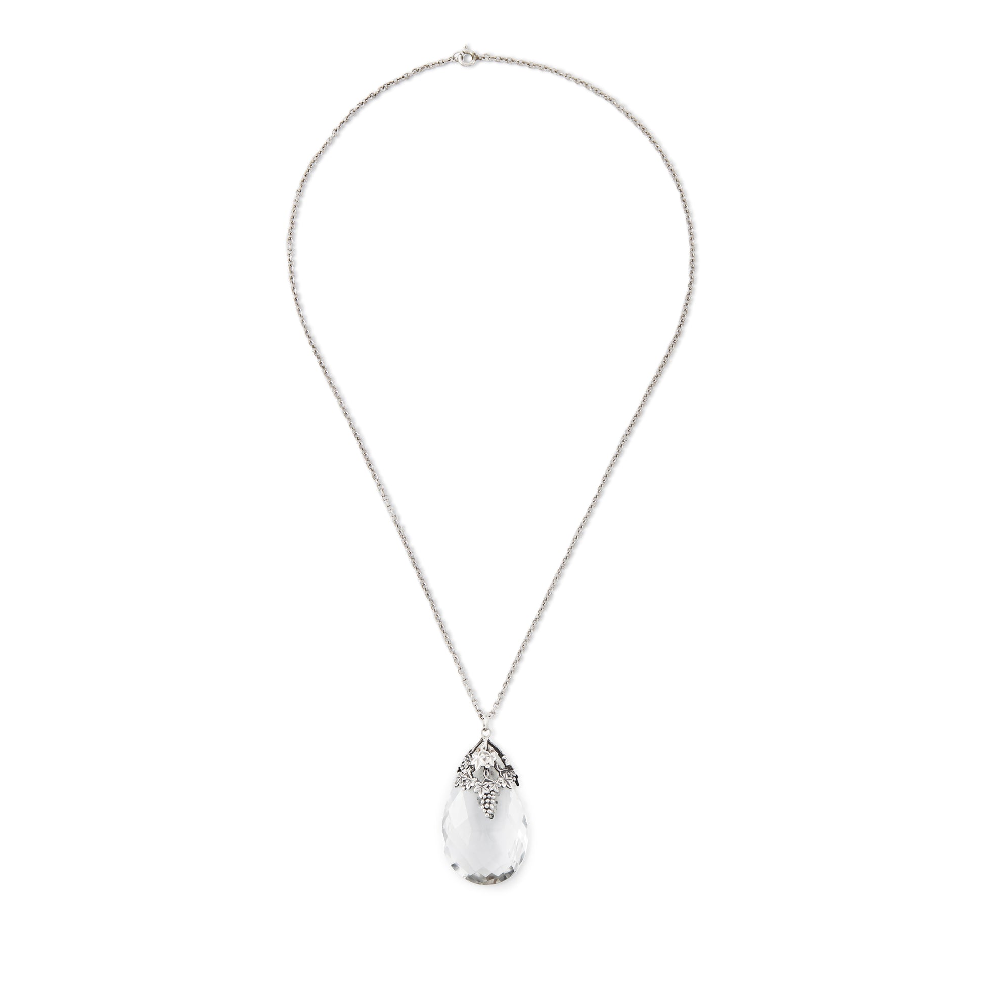 Lovely large Art Nouveau rock crystal teardrop pendant with silver grape leaf embellishment. On a silver chain.