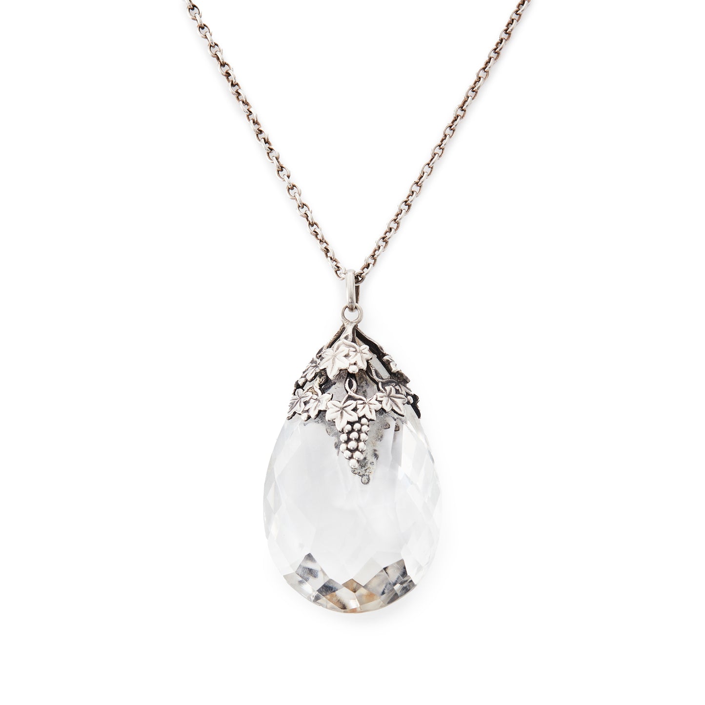 Lovely large Art Nouveau rock crystal teardrop pendant with silver grape leaf embellishment. On a silver chain.