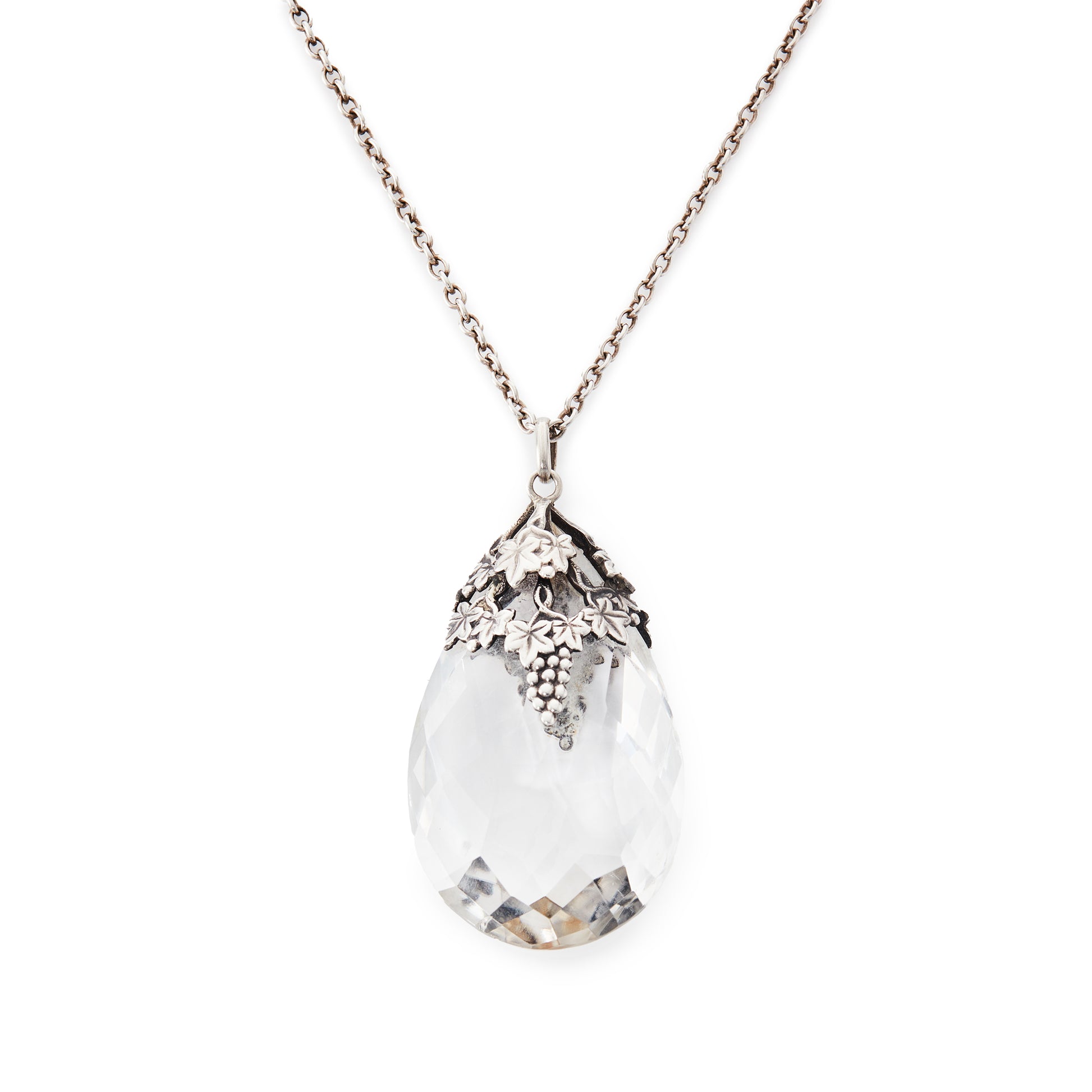 Lovely large Art Nouveau rock crystal teardrop pendant with silver grape leaf embellishment. On a silver chain.