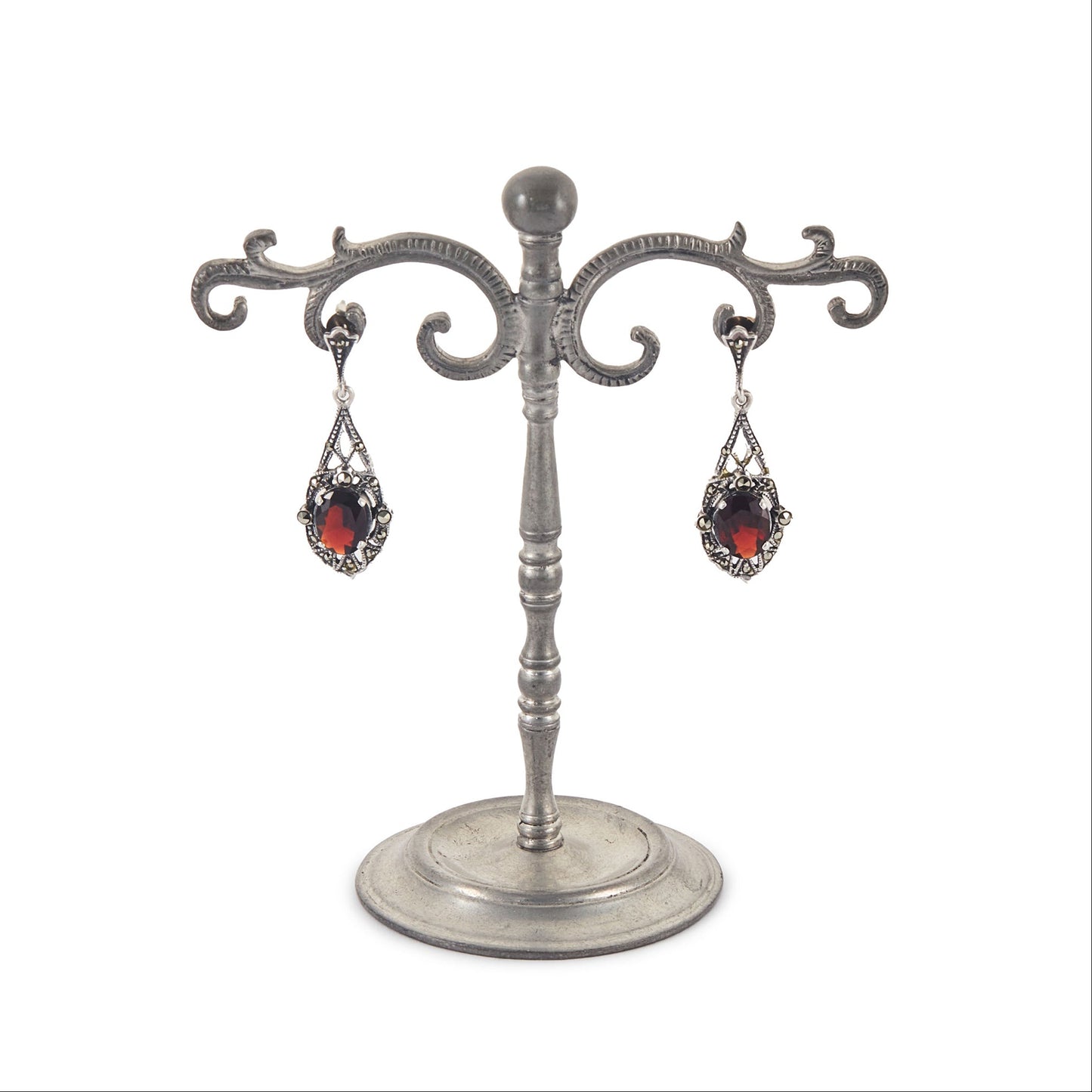 Stunning sterling silver drop earrings, each set with a beautifully faceted garnet and marcasite stones.