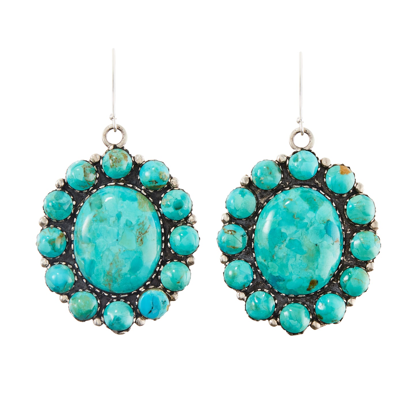 Stunning large handmade sterling silver Native American earrings with natural, vibrant turquoise stones in a cluster petit point setting.
Stamped “Sterling” with a feather marking.