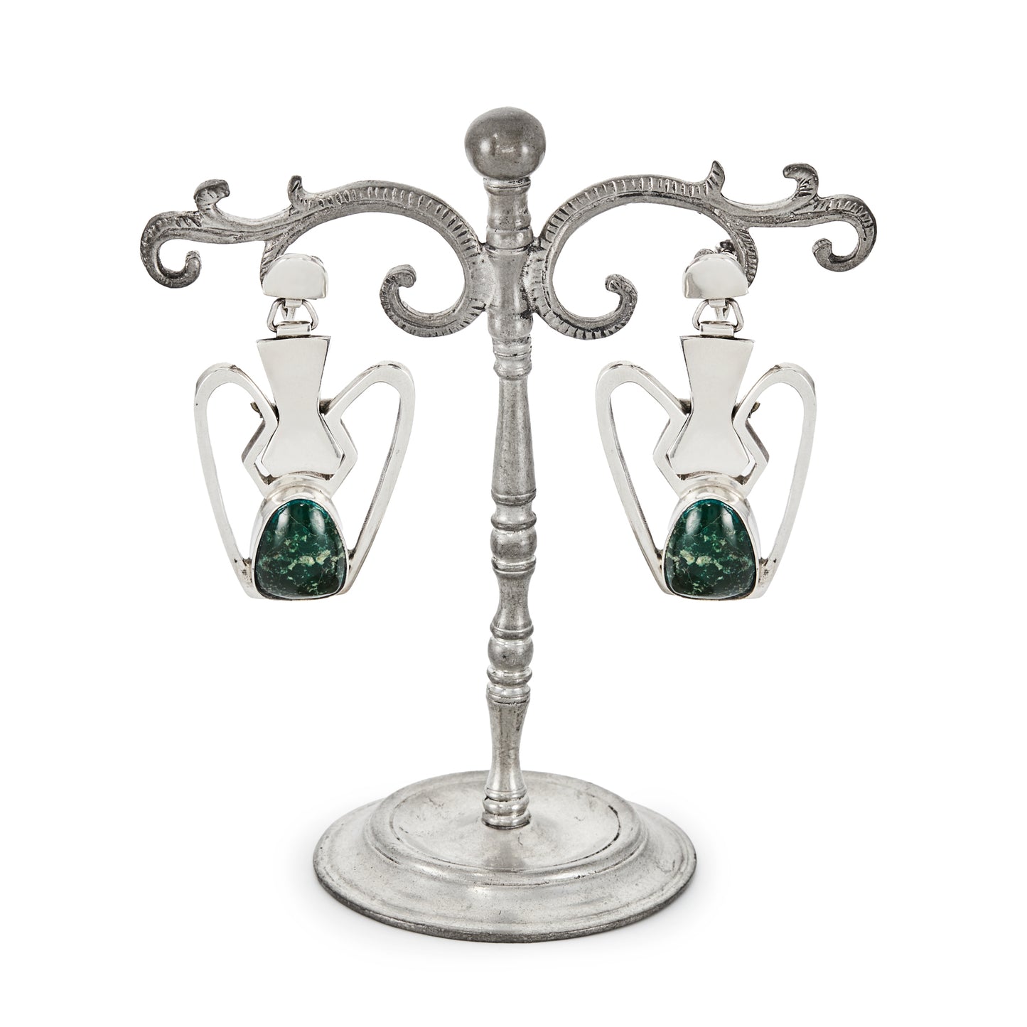 Stunning sterling silver Mexican earrings, set with natural green gemstones. Screw back fasteners. Eagle Mark (pre 1979).
Designer: Erika Hult de Corral.