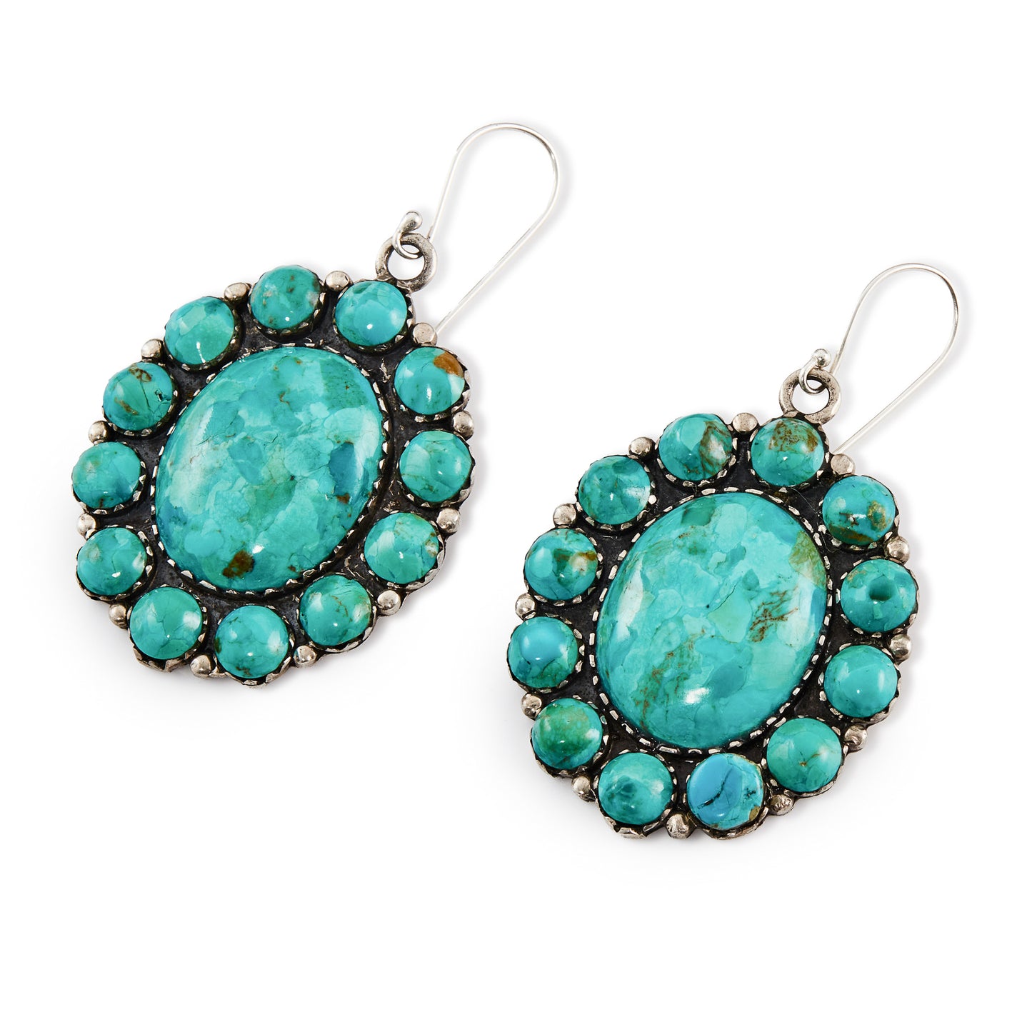 Stunning large handmade sterling silver Native American earrings with natural, vibrant turquoise stones in a cluster petit point setting.
Stamped “Sterling” with a feather marking.