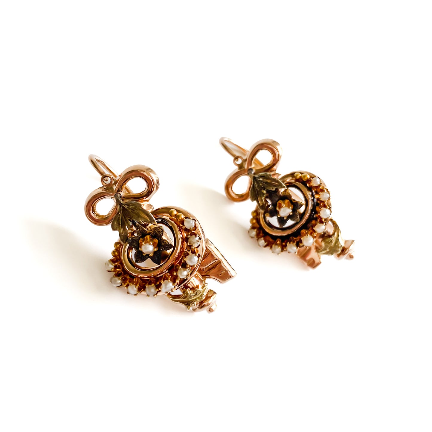 Exquisite Victorian rose and yellow gold earrings each set with ten tiny seed pearls. Front fastening shepherd hooks.