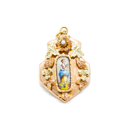 Pretty Victorian rose gold pendant set with a hand-painted porcelain miniature depicting a lady, surrounded by rose and yellow gold flowers containing one seed pearl.