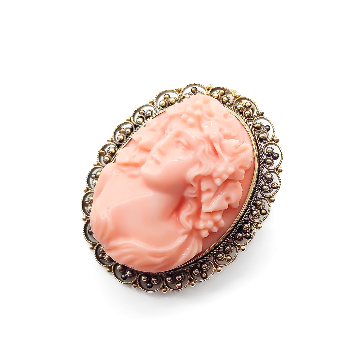 Beautifully hand-carved Victorian coral cameo set in a 14ct yellow gold filigree frame. Can be worn as either a pendant or brooch.