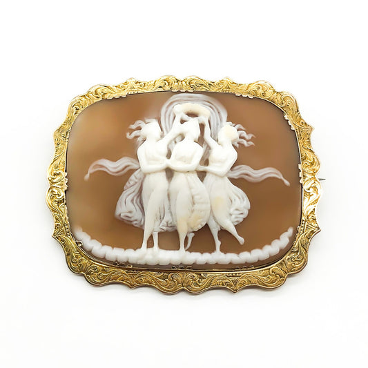 Gorgeous Victorian 15ct gold brooch with a beautiful carving of the three graces set in a gold frame with intricate engraving. Can also be worn as a pendant.