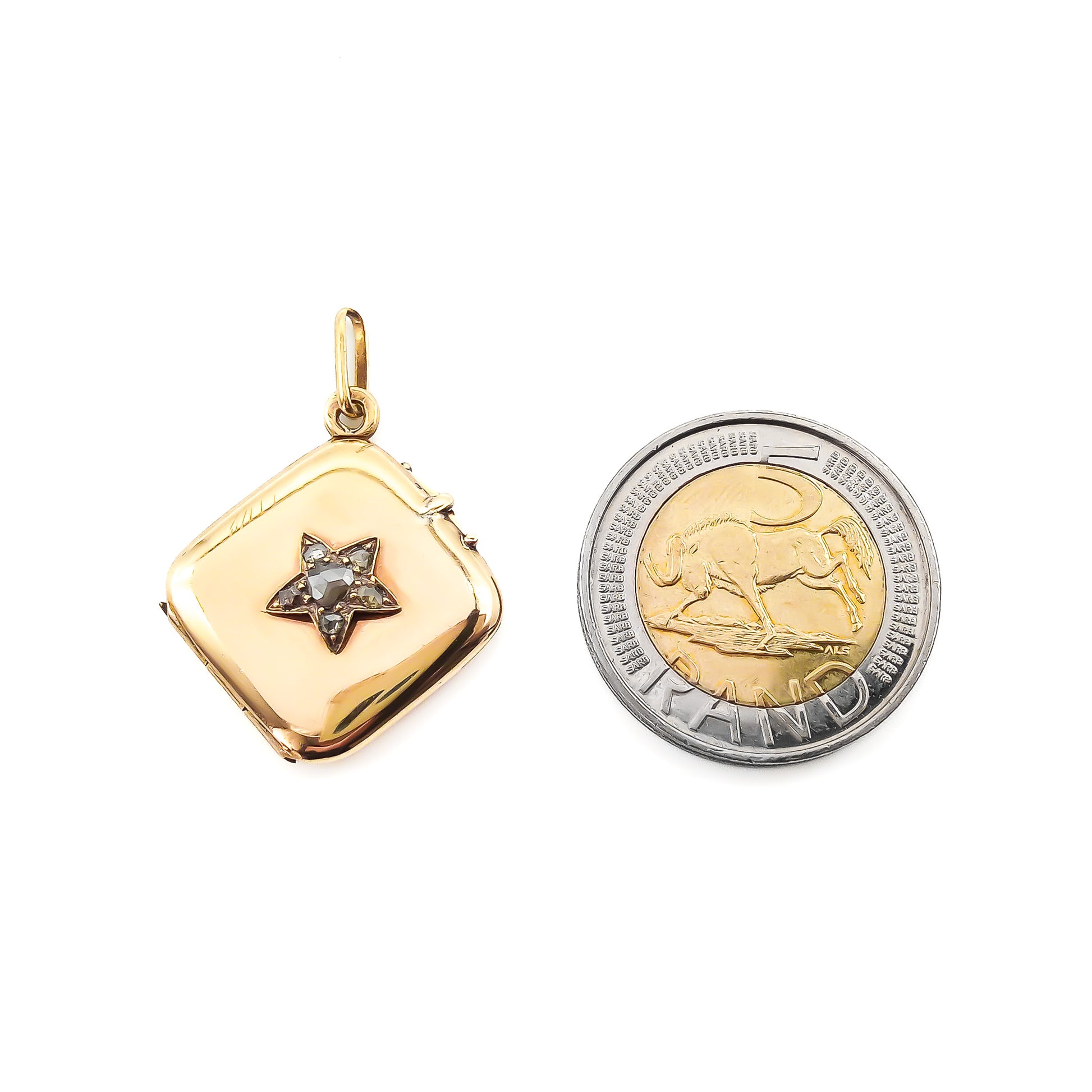 Charming Victorian 18ct yellow gold locket set with six rose cut diamonds in the form of a star. Circa 1900