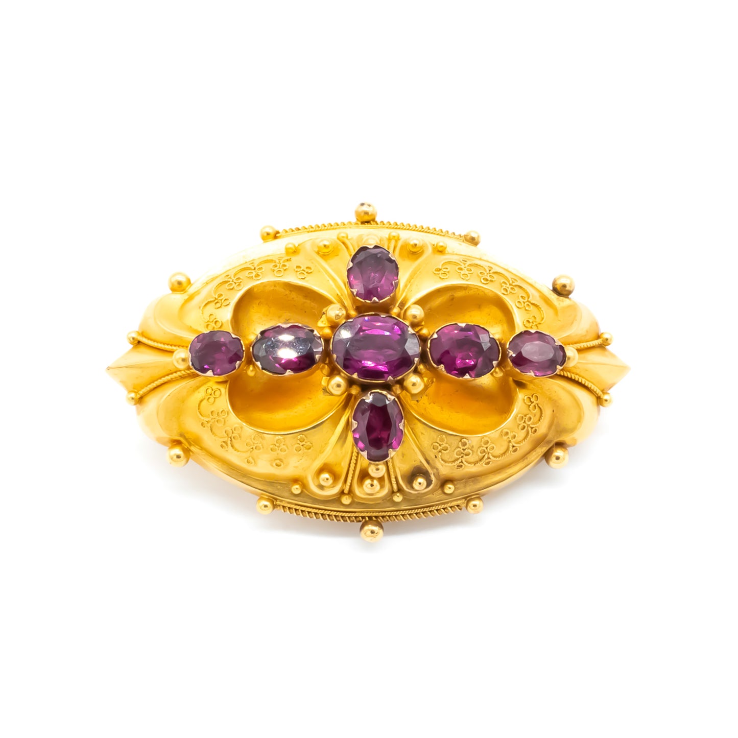 Magnificent Victorian 18ct yellow gold Etruscan brooch set with seven beautifully faceted purplish-red almandine garnets.