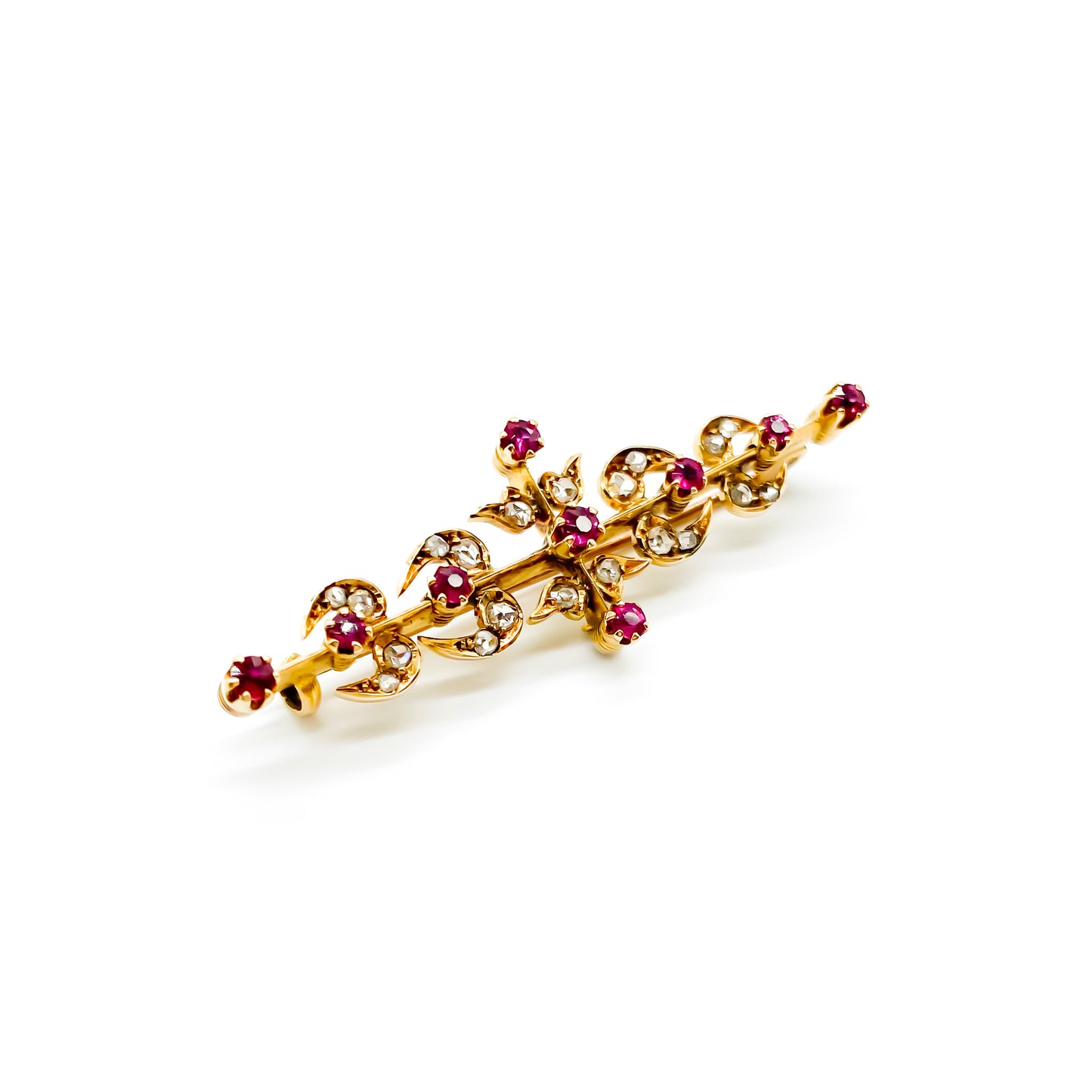 Dainty Victorian 18ct gold bar brooch set with nine rubies and twenty mine cut diamonds.