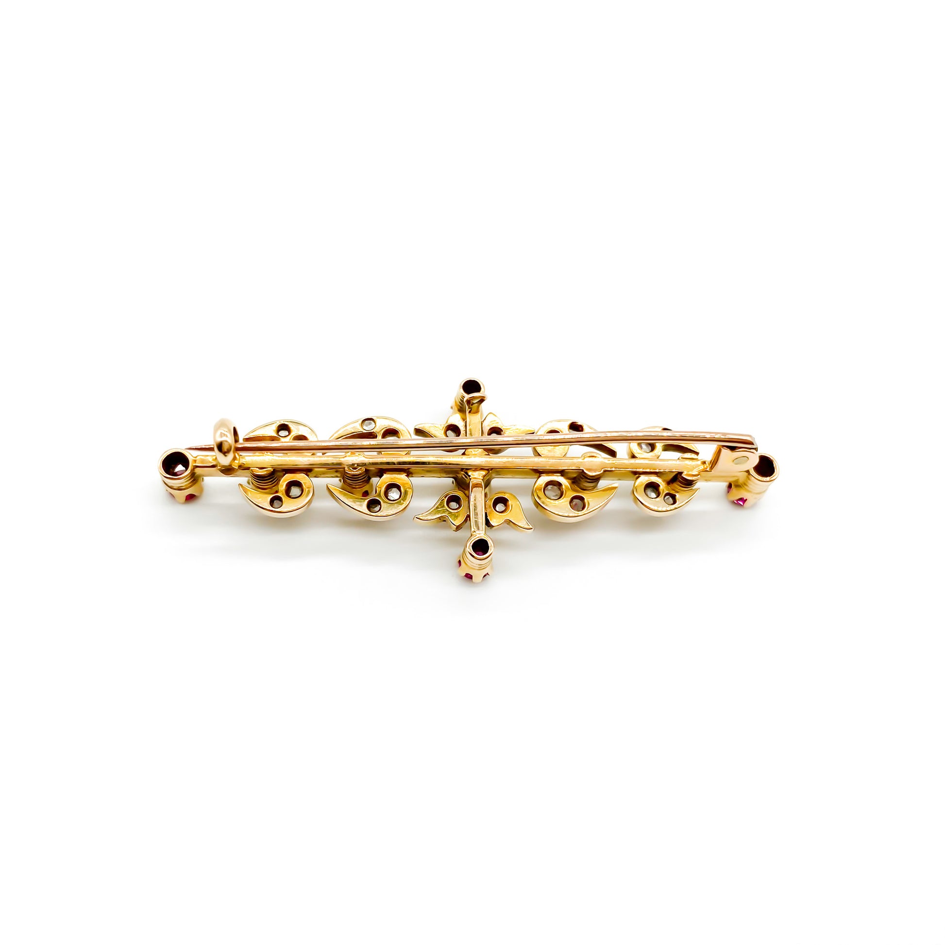 Dainty Victorian 18ct gold bar brooch set with nine rubies and twenty mine cut diamonds.