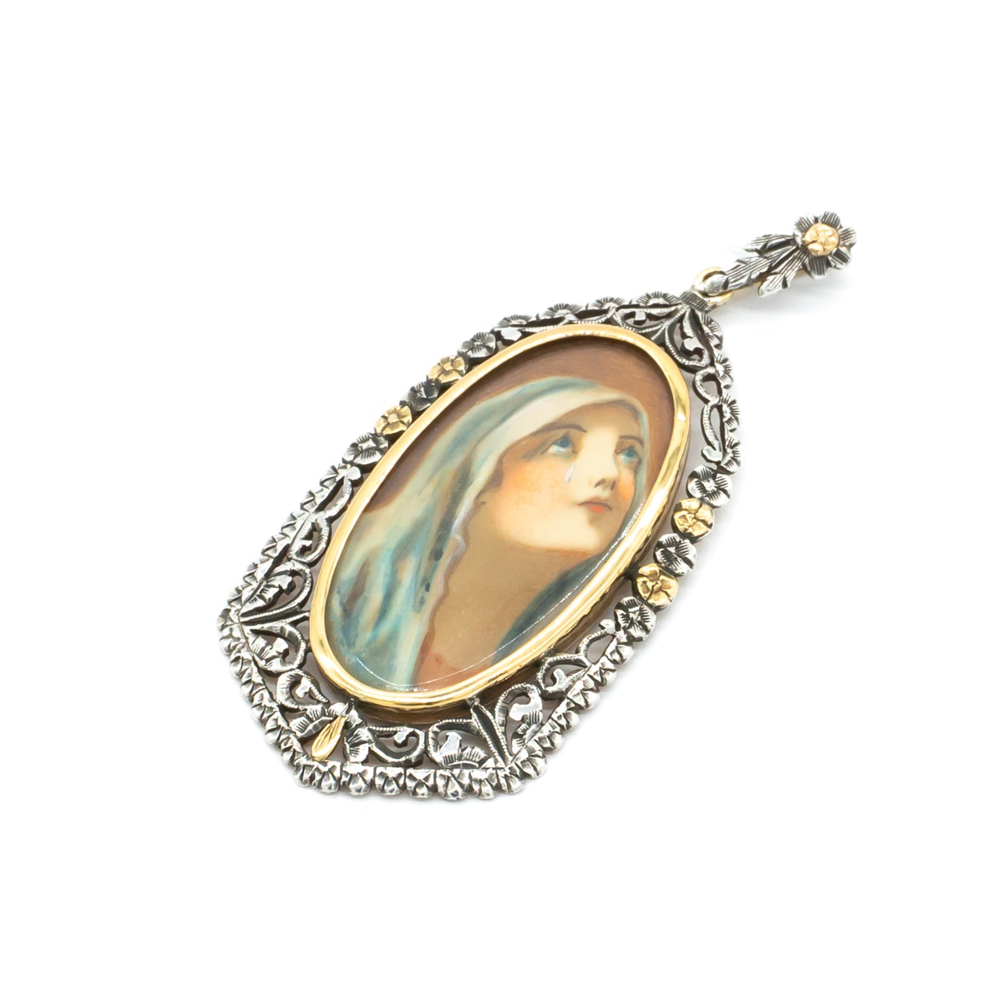 Beautifully hand-painted Victorian Madonna pendant set in an ornate, floral 18ct gold and silver frame.