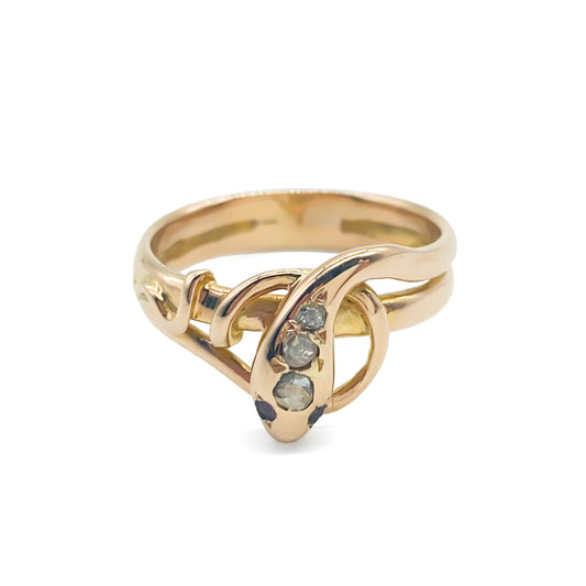 Charming 18ct rose gold serpent ring set with three old cut diamonds and garnet eyes.