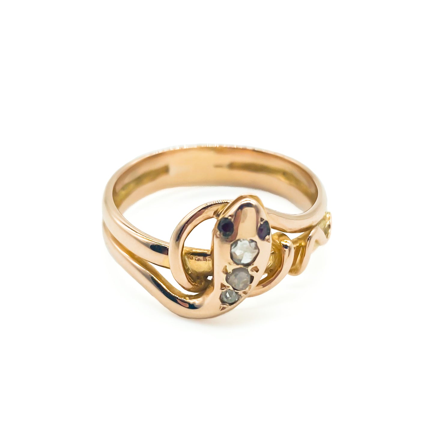 Charming 18ct rose gold serpent ring set with three old cut diamonds and garnet eyes.