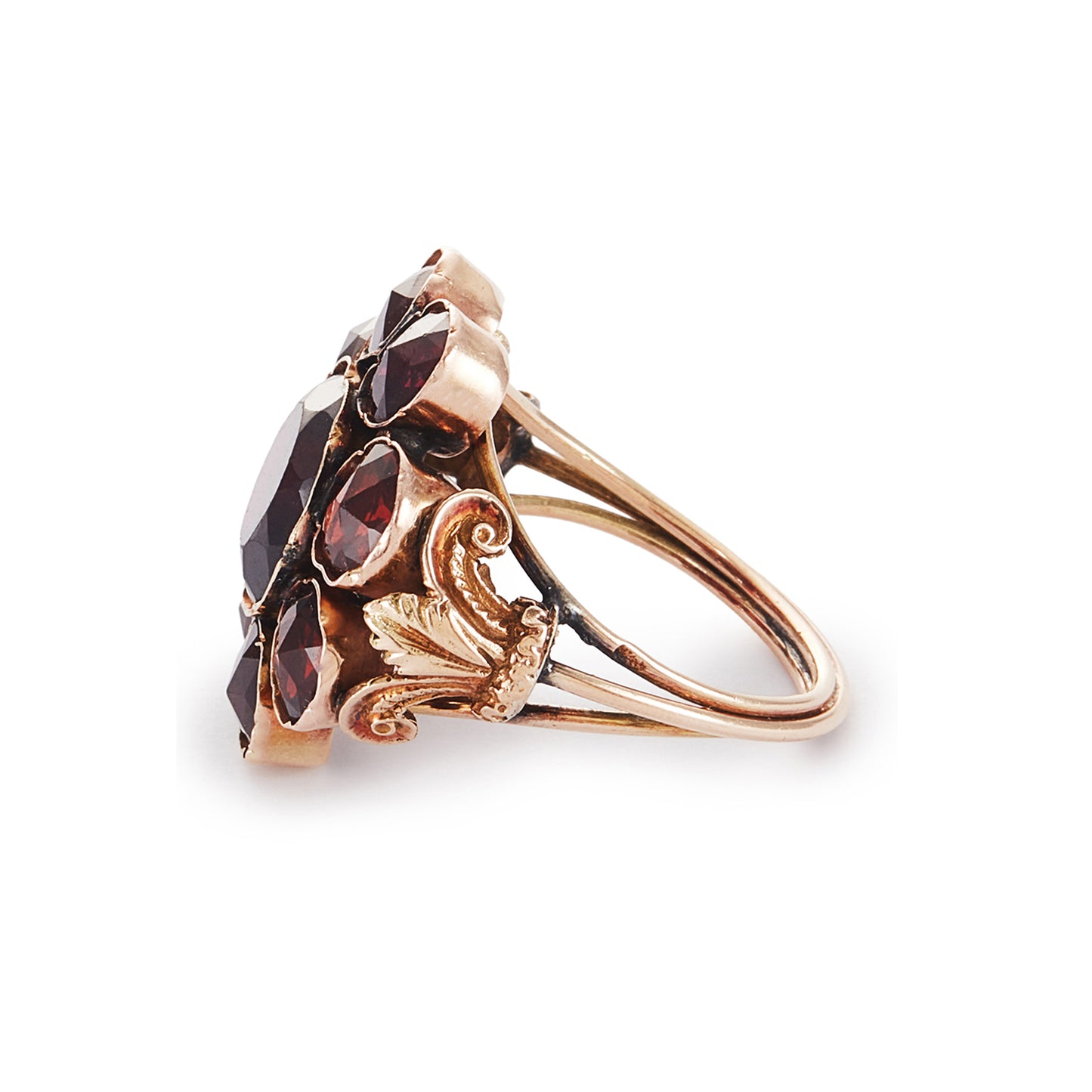 Spectacular Victorian 9ct gold cocktail ring with nine deep red Bohemian garnets in a cluster setting. The ring has lovely scrollwork detail on the shoulders.