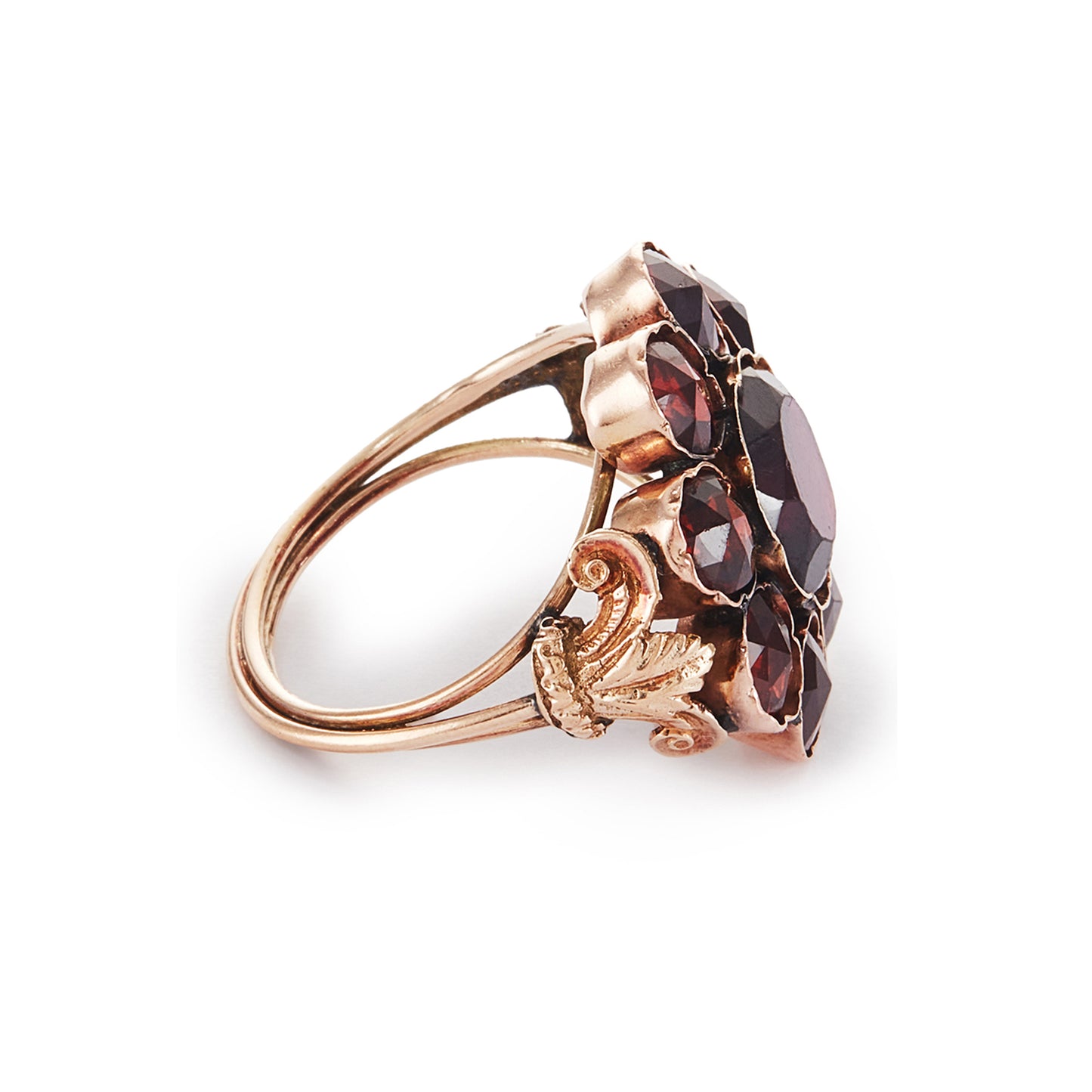 Spectacular Victorian 9ct gold cocktail ring with nine deep red Bohemian garnets in a cluster setting. The ring has lovely scrollwork detail on the shoulders.