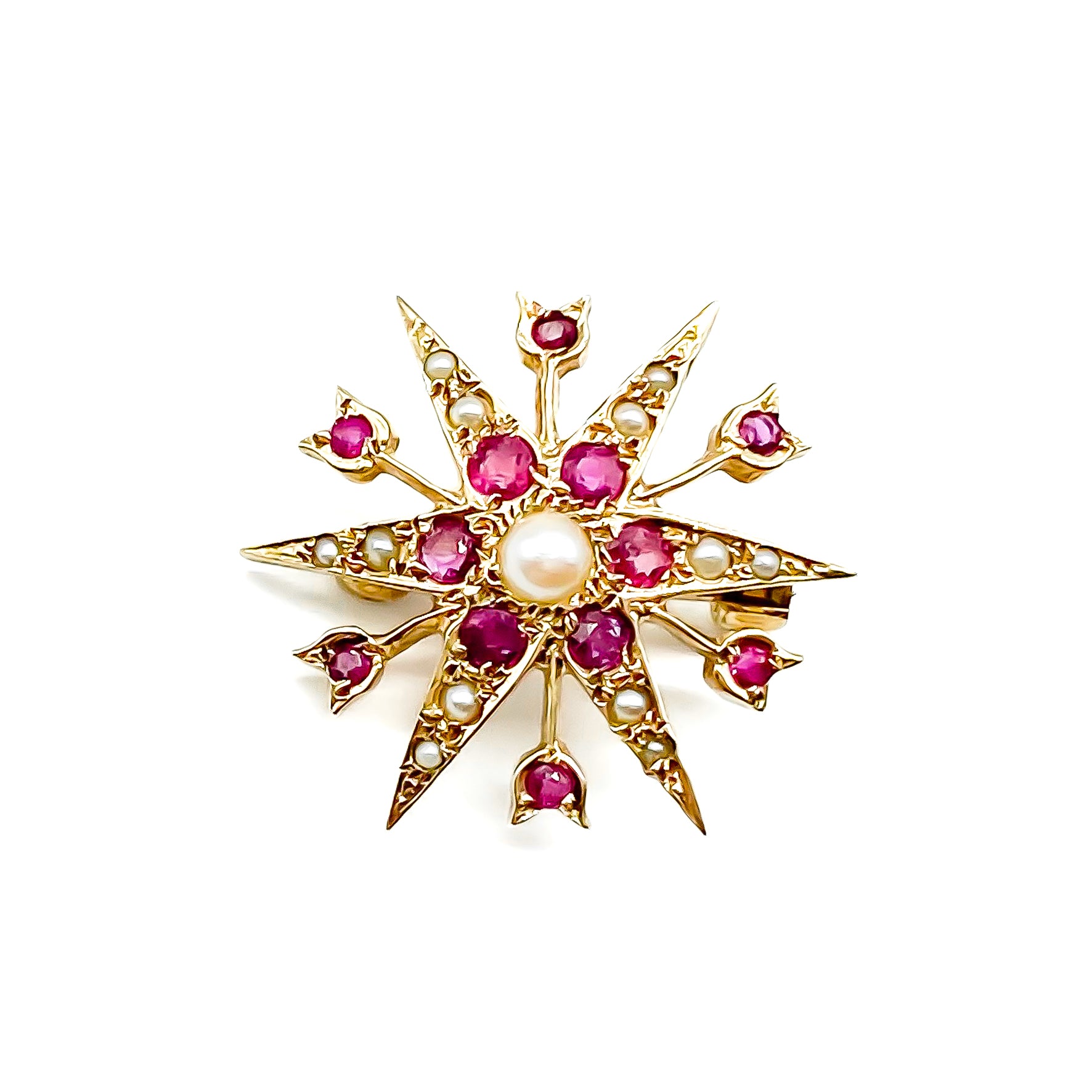 Delicate Victorian 9ct yellow gold star brooch set with twelve faceted rubies and seed pearls. 