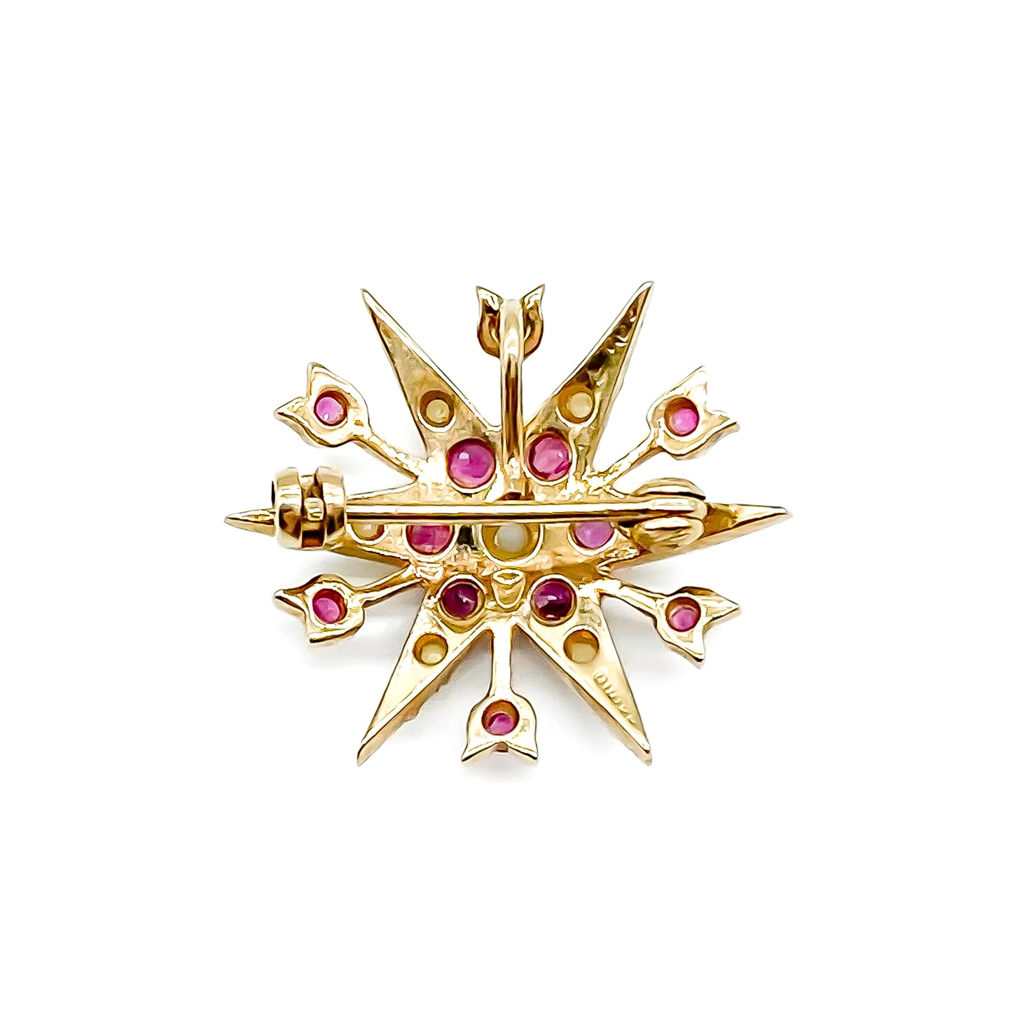 Delicate Victorian 9ct yellow gold star brooch set with twelve faceted rubies and seed pearls.