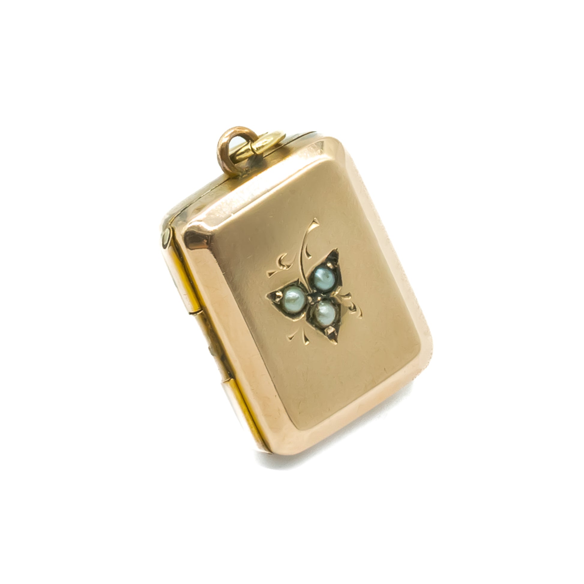Charming Victorian 9ct rose gold-cased locket set with three seed pearls within a fine leaf engraving.