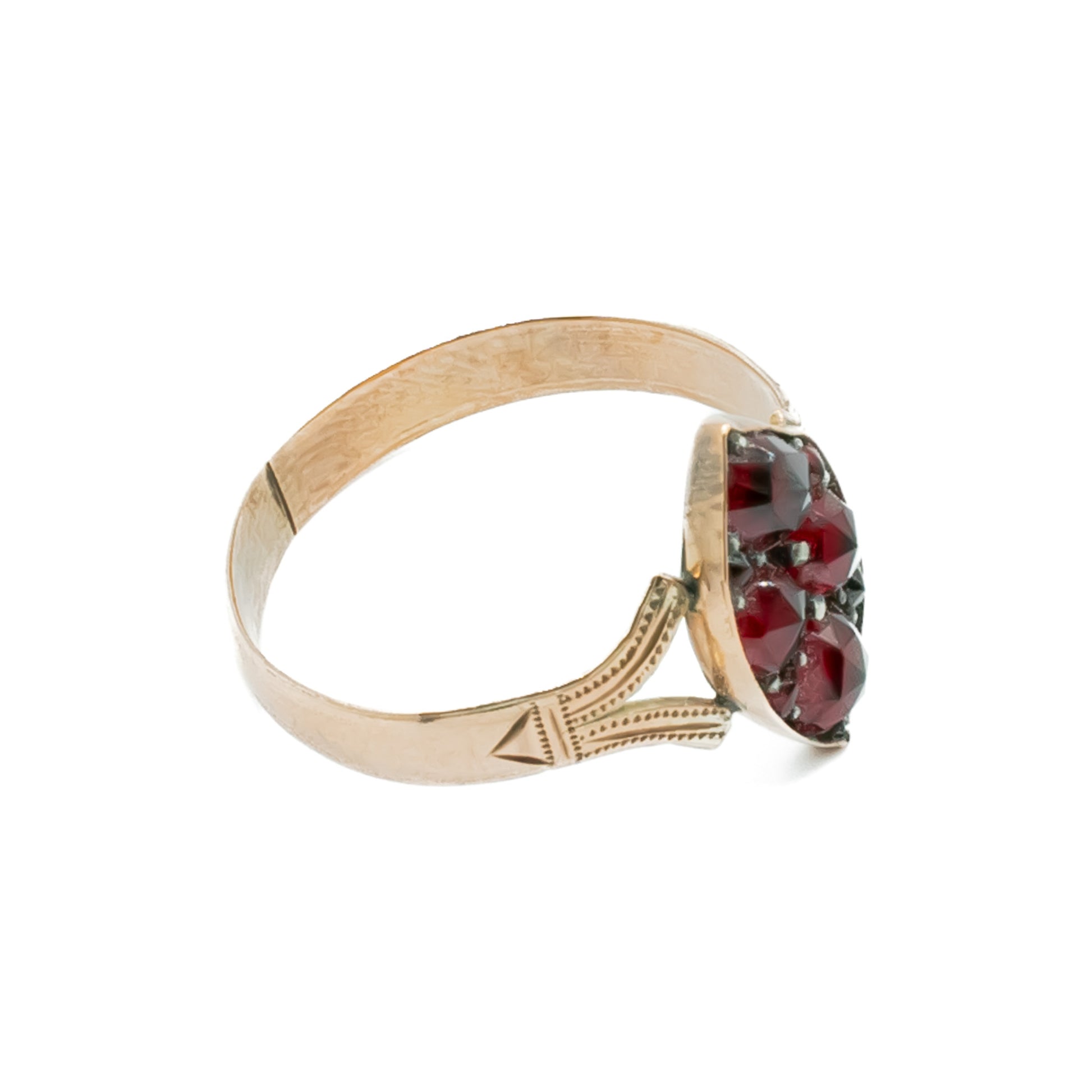 Dainty Victorian 9ct rose gold ring set with eight deep red faceted garnets.