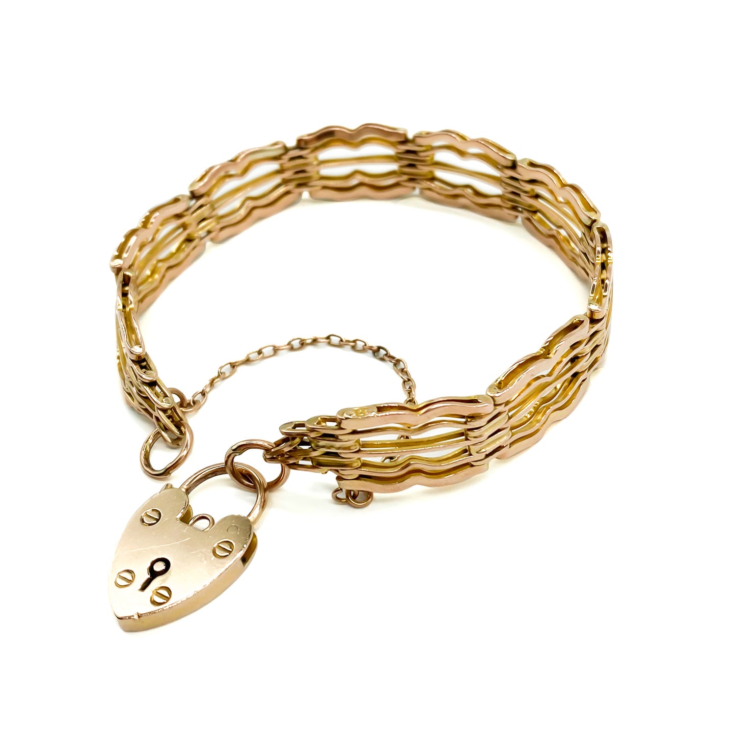 Stylish Victorian 9ct rose gold gateleg bracelet with a padlock and safety chain.