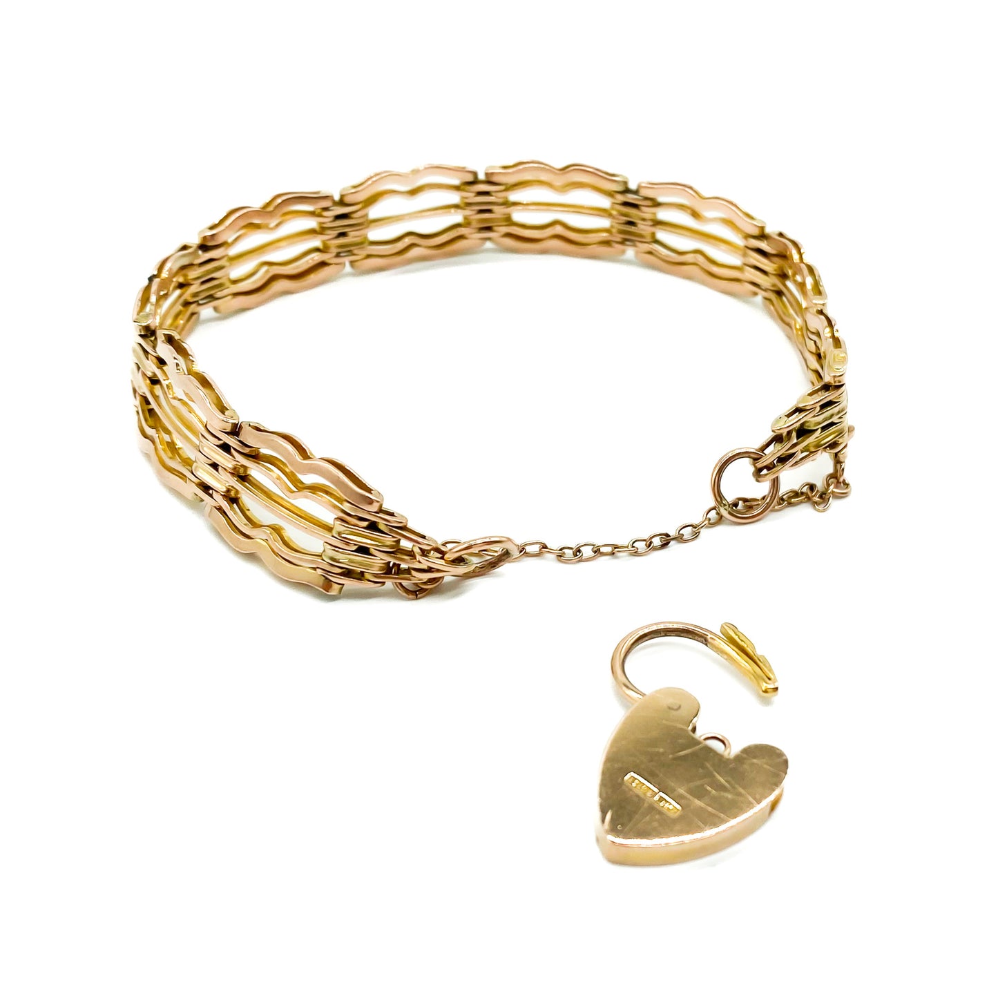 Stylish Victorian 9ct rose gold gateleg bracelet with a padlock and safety chain.