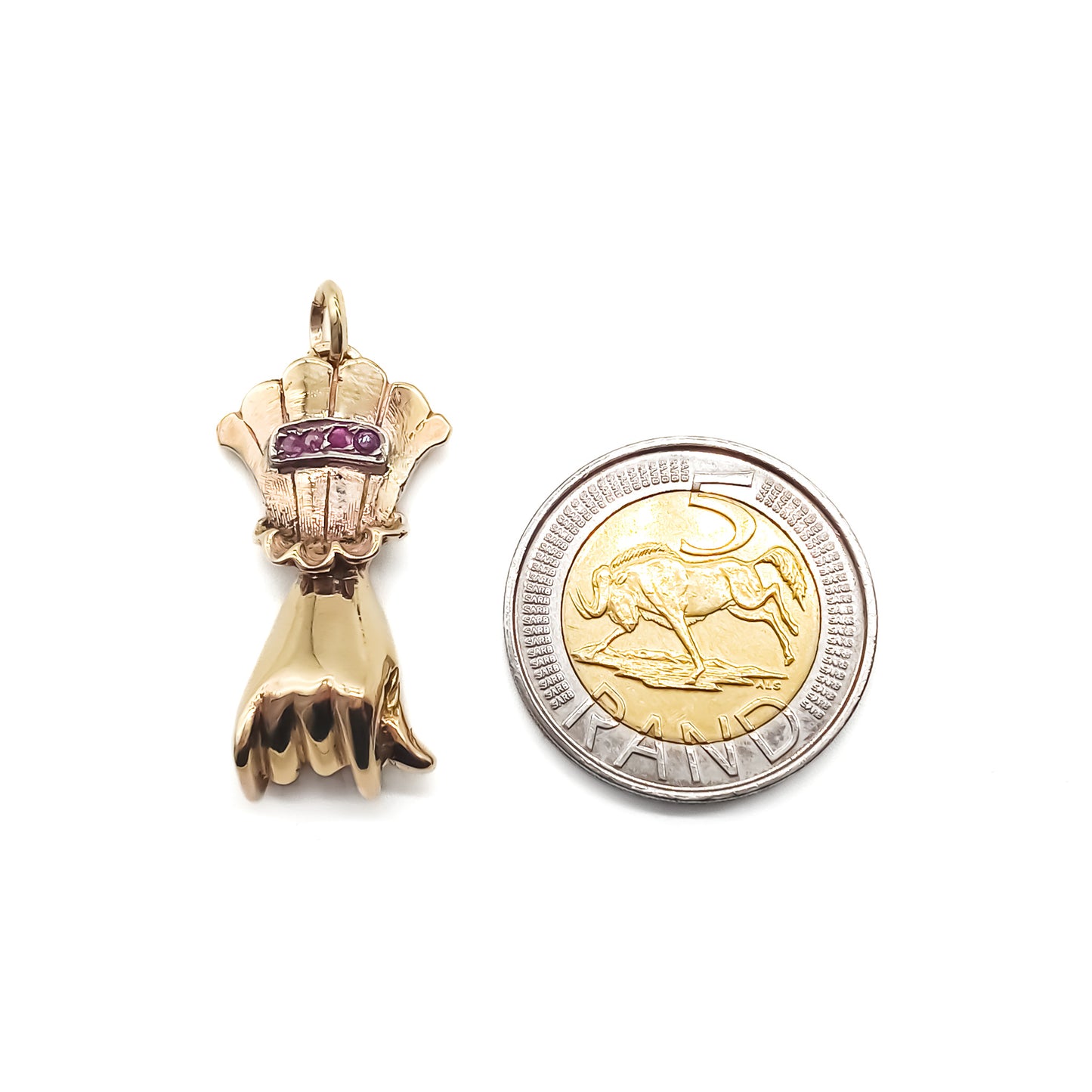 Sought-after Victorian 9ct rose gold hand pendant set with four faceted rubies.