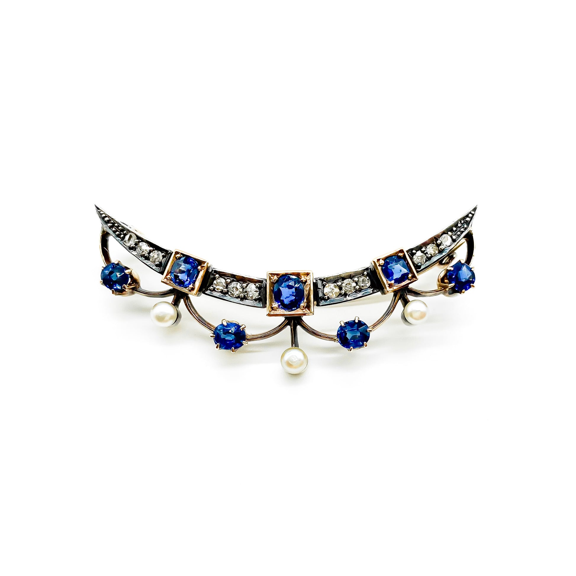 Very pretty Victorian 9ct rose gold and silver crescent brooch set with cornflower blue sapphires, diamonds and seed pearls.