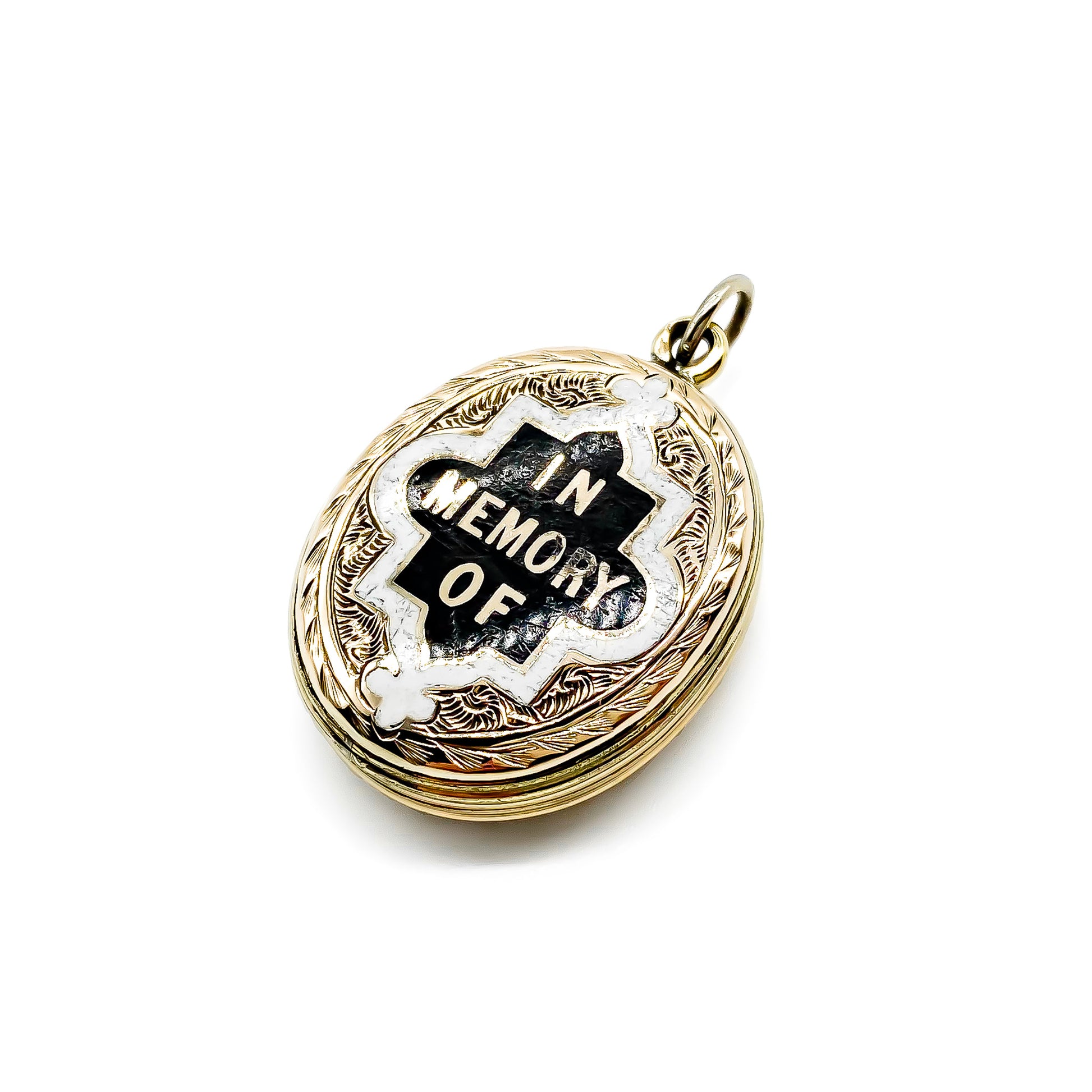 Beautifully engraved Victorian black and white enamelled gold-cased mourning locket.