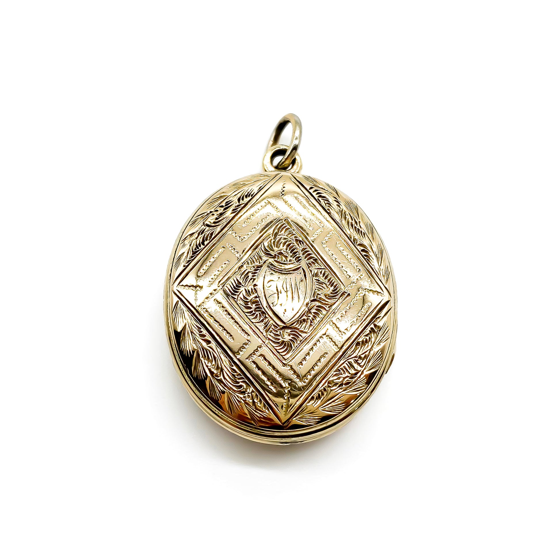 Beautifully engraved Victorian black and white enamelled gold-cased mourning locket.