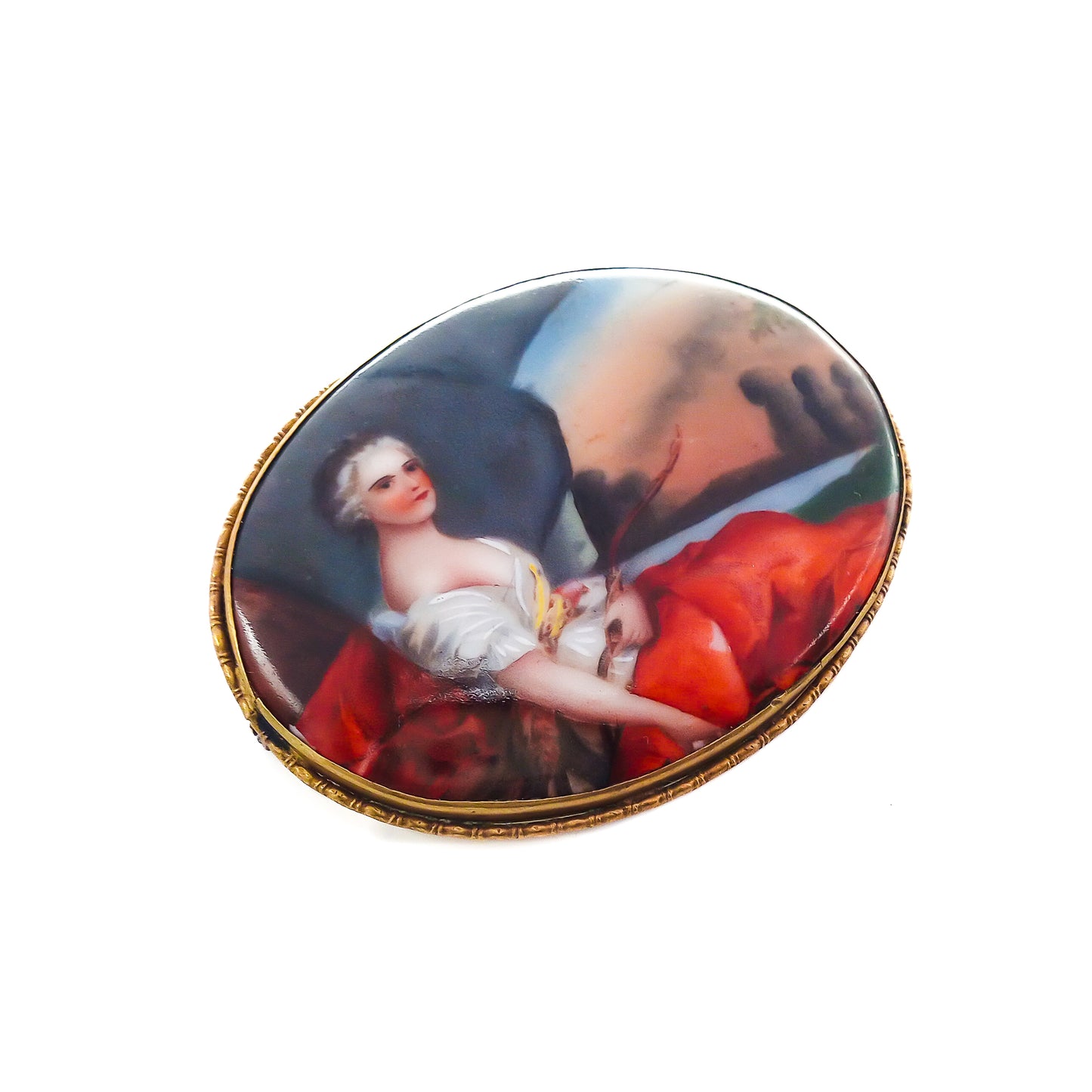 Unusually large Victorian hand painted portrait brooch depicting a lovely lady in a pastoral scene, with a brass frame.