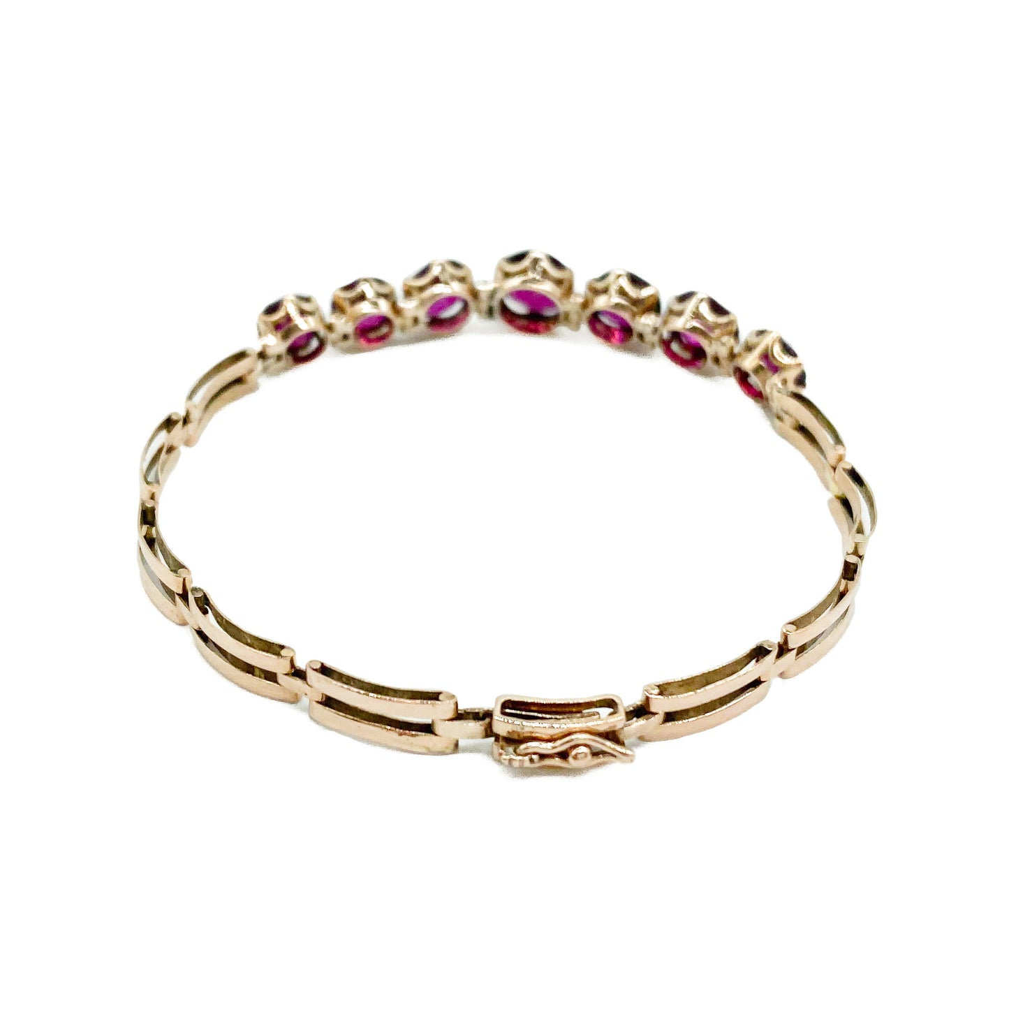 Gorgeous Victorian rose gold bracelet set with seven beautifully faceted rhodolite garnets.