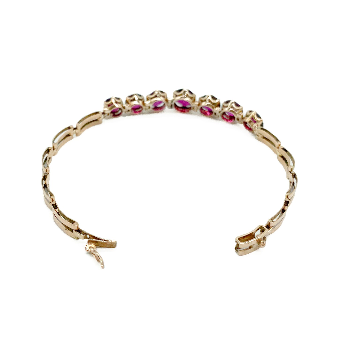 Gorgeous Victorian rose gold bracelet set with seven beautifully faceted rhodolite garnets.