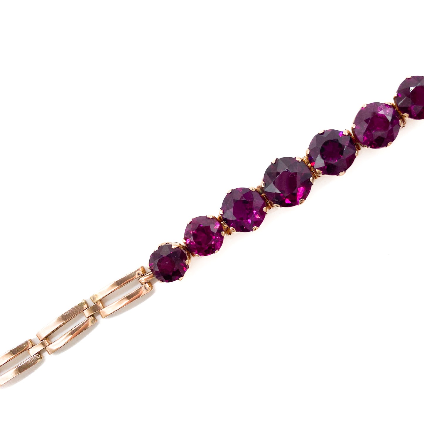 Gorgeous Victorian rose gold bracelet set with seven beautifully faceted rhodolite garnets.