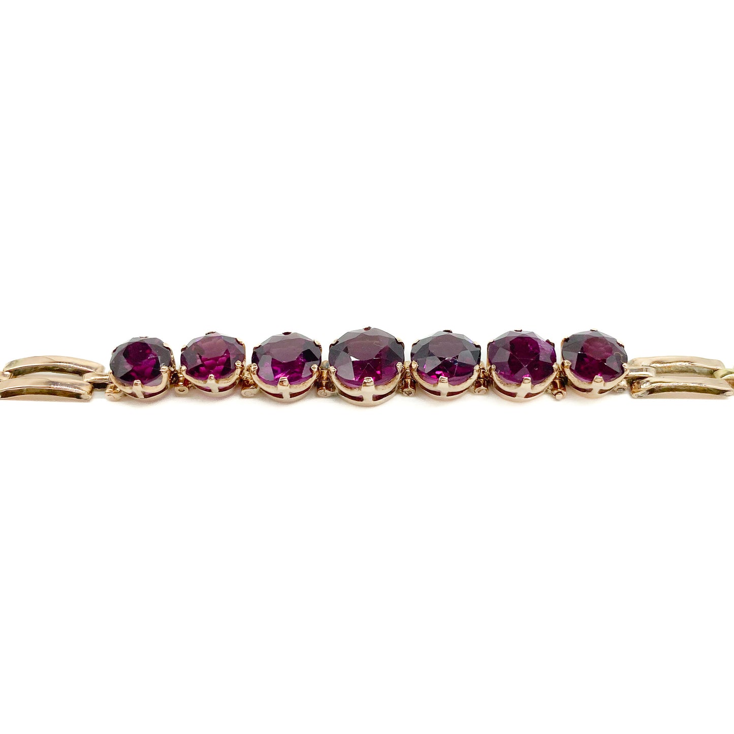 Gorgeous Victorian rose gold bracelet set with seven beautifully faceted rhodolite garnets.