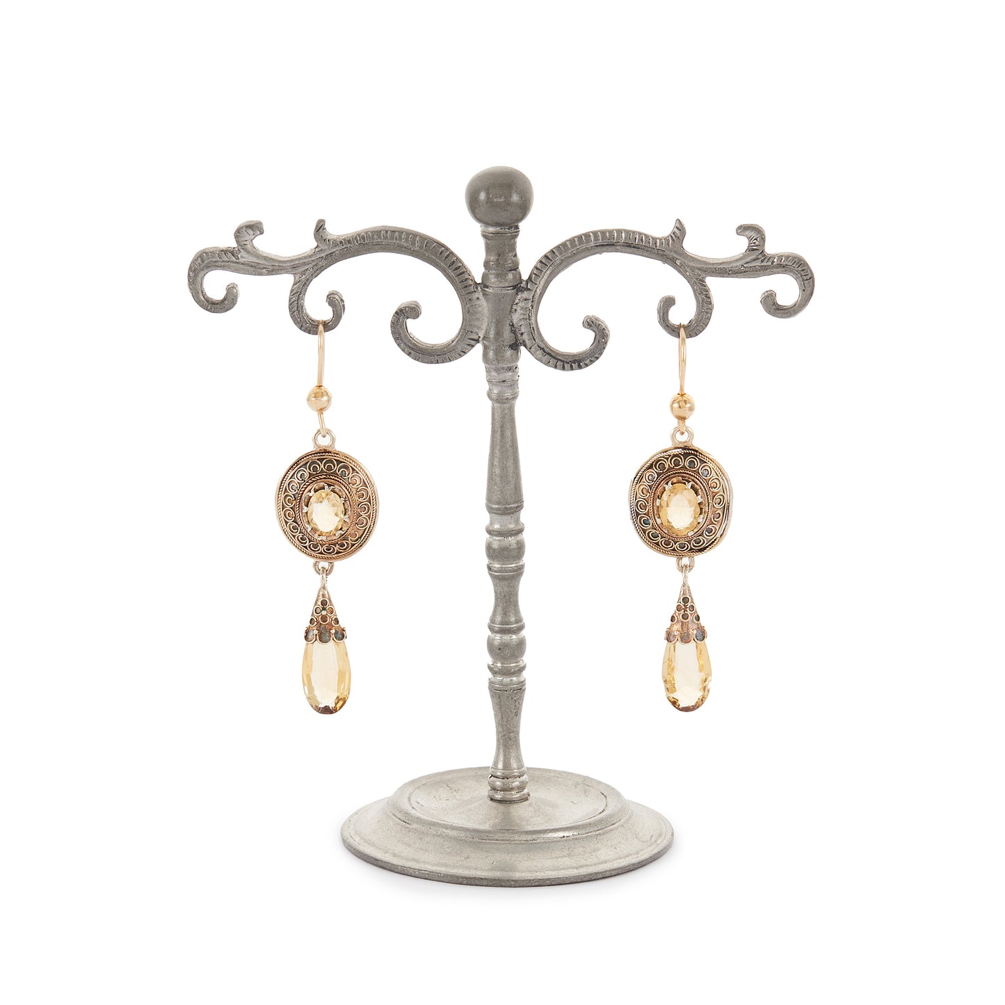 Gorgeous Victorian silver-gilt earrings, each set with a beautifully faceted citrine and a dangling citrine drop. The earrings feature beautiful scroll work detail on the metal.