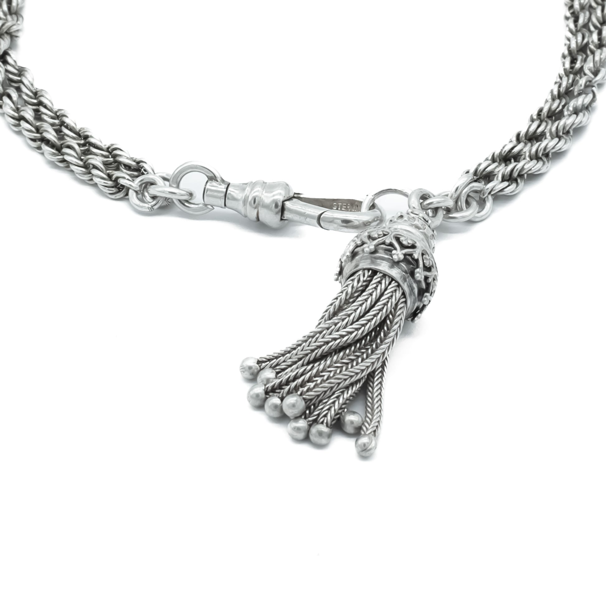 Lovely Victorian albertina bracelet with two beautifully embossed silver beads, a tassel and dog clip.