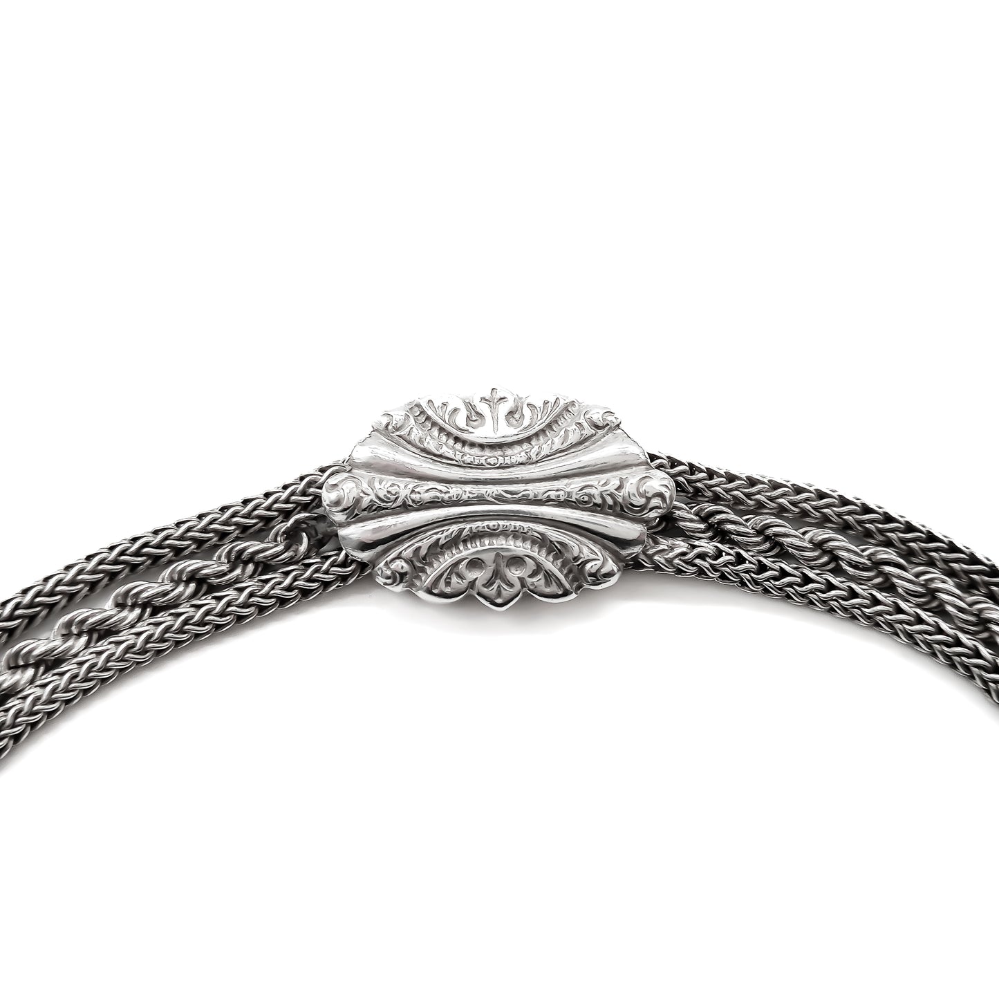 Victorian silver albertina bracelet with ornate detail, a dog clip, a tassel and a heart charm.