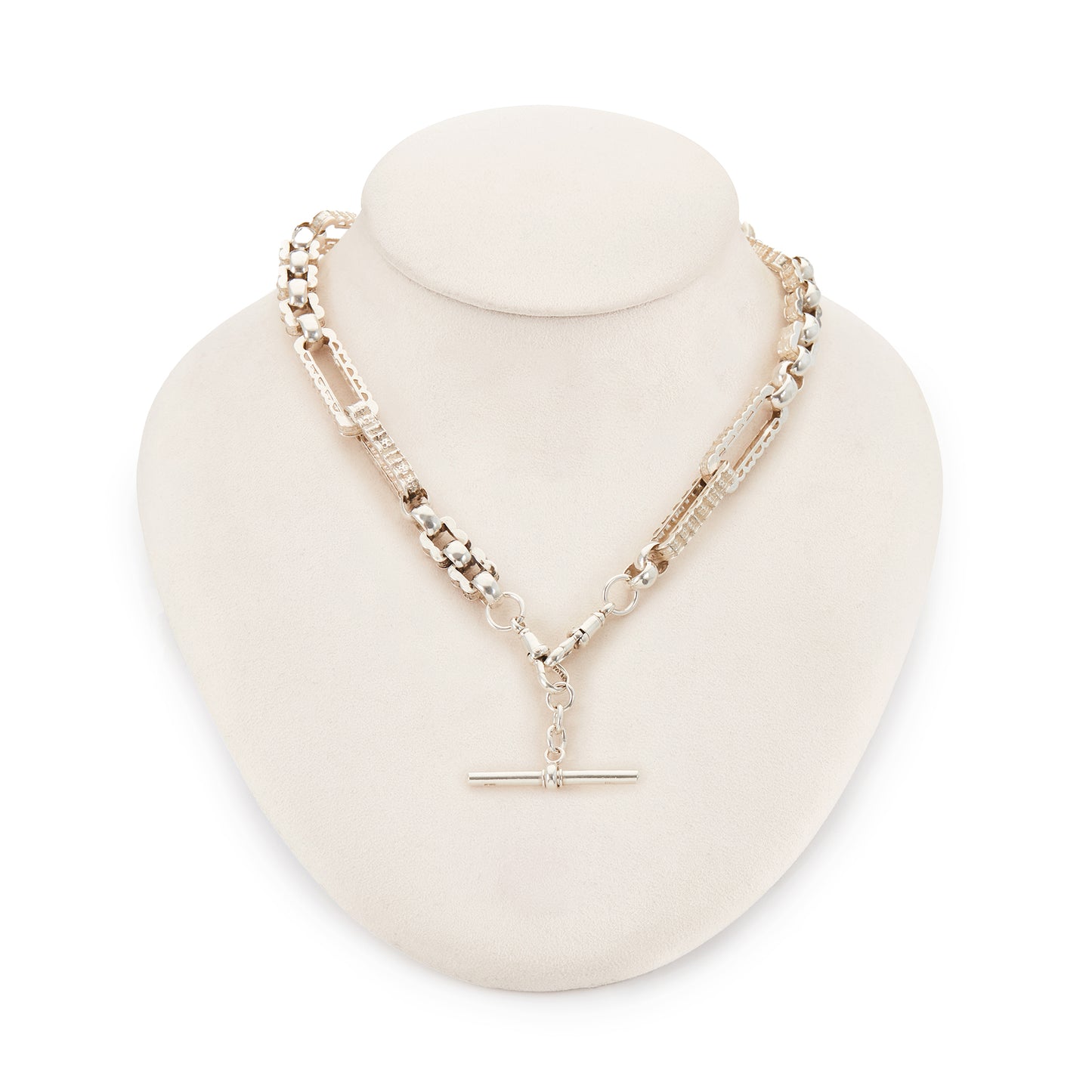 Stylish silver Victorian fob chain consisting of large, hollow, fancy links as well as two dog-clips and a t-bar.