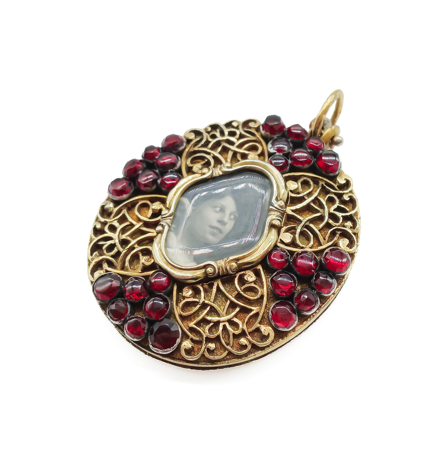 Unique Victorian silver gilt mourning pendant with ornate detail, set with twenty-eight deep red garnets.