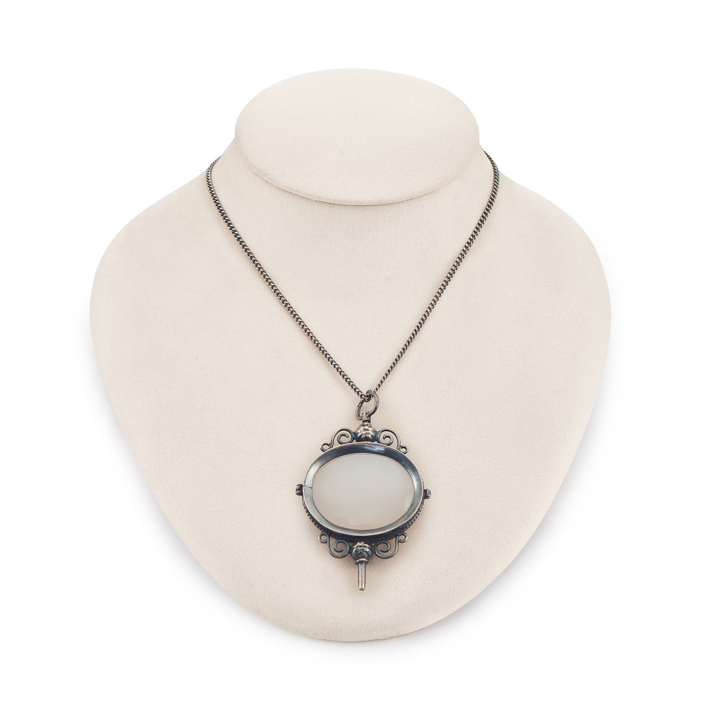 Charming Victorian oxidised silver and agate key winder pendant on a long chain.