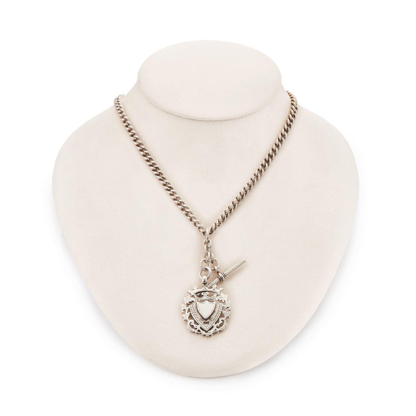 Classic Victorian sterling silver curb-link fob chain with an ornate medallion, a t-bar and two dog-clips.